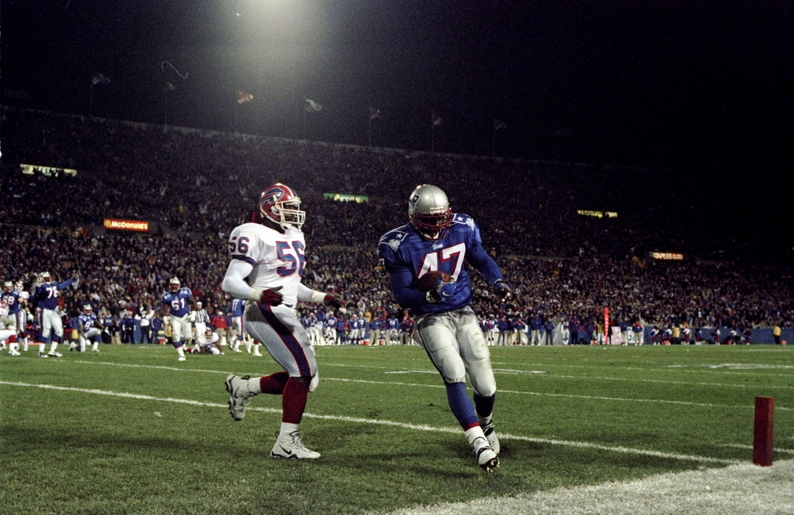 29 Nov 1998:  Running back Robert Edwards #47 of the New England Patriots in action against linebacker Sam Cowart #56 of the Buffalo Bills during a game at Foxboro Stadium in Foxboro, Massachusetts. The Patriots defeated the Bills 25-21. Mandatory Credit: