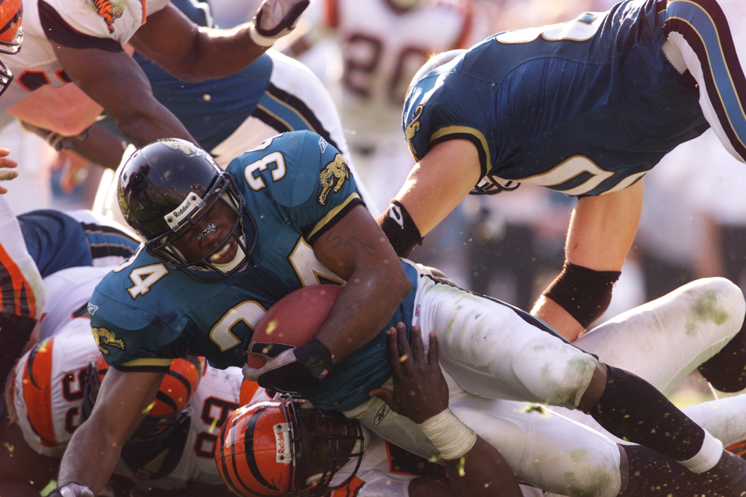 11 Nov 2001 : Stacey Mack #34 of the Jacksonville Jaguars takes a fall by a tackle of the Cincinnati Bengals during the game at Alltell Stadium in Jacksonville, Florida.  The Jaguars won 30-13. DIGITAL IMAGE. Mandatory Credit: Andy Lyons/Allsport