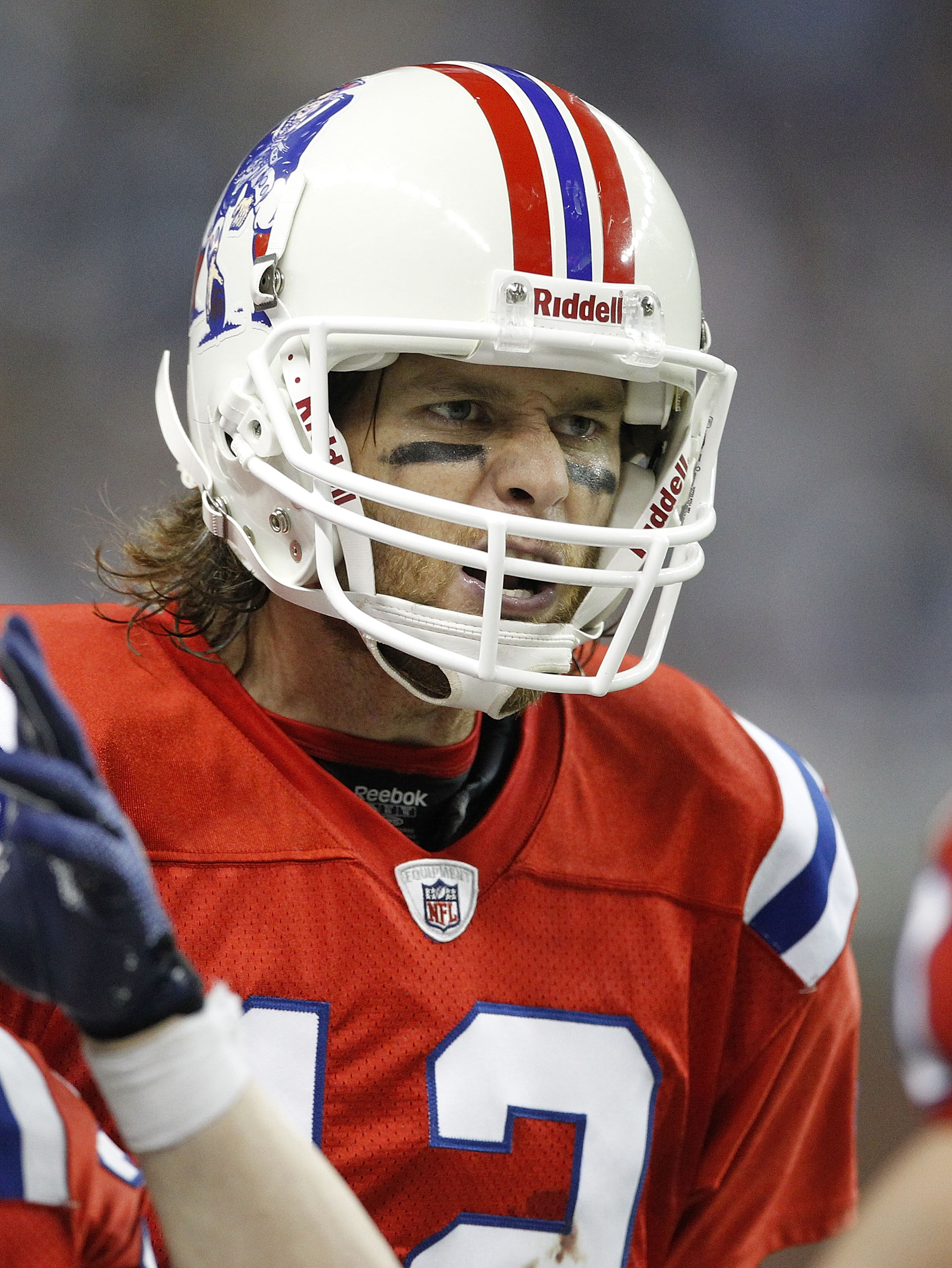 DETROIT - NOVEMBER 25:  Tom Brady #12 of the New England Patriots reacts after a Detroit Lions turnover during the game against the Detroit Lions at Ford Field on November 25, 2010 in Detroit, Michigan. New England defeated Detroit 45-24.  (Photo by Leon