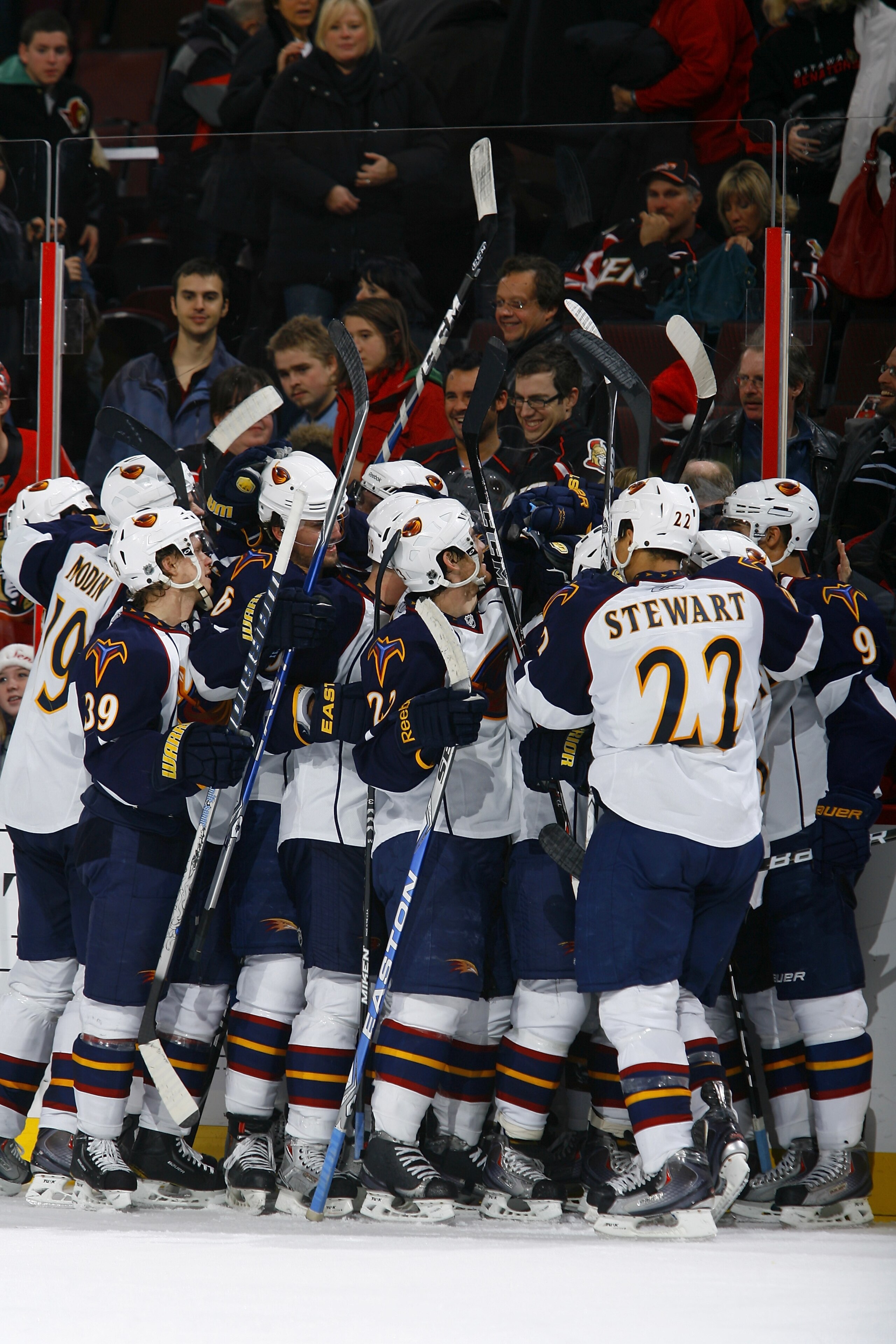 OTTAWA, ON - DECEMBER 13:  The Atlanta Thrashers mob teammate Bryan Little #10 after his game winning goal in overtime against the Ottawa Senators in a game at Scotiabank Place on December 13, 2010 in Ottawa, Canada.  (Photo by Phillip MacCallum/Getty Ima