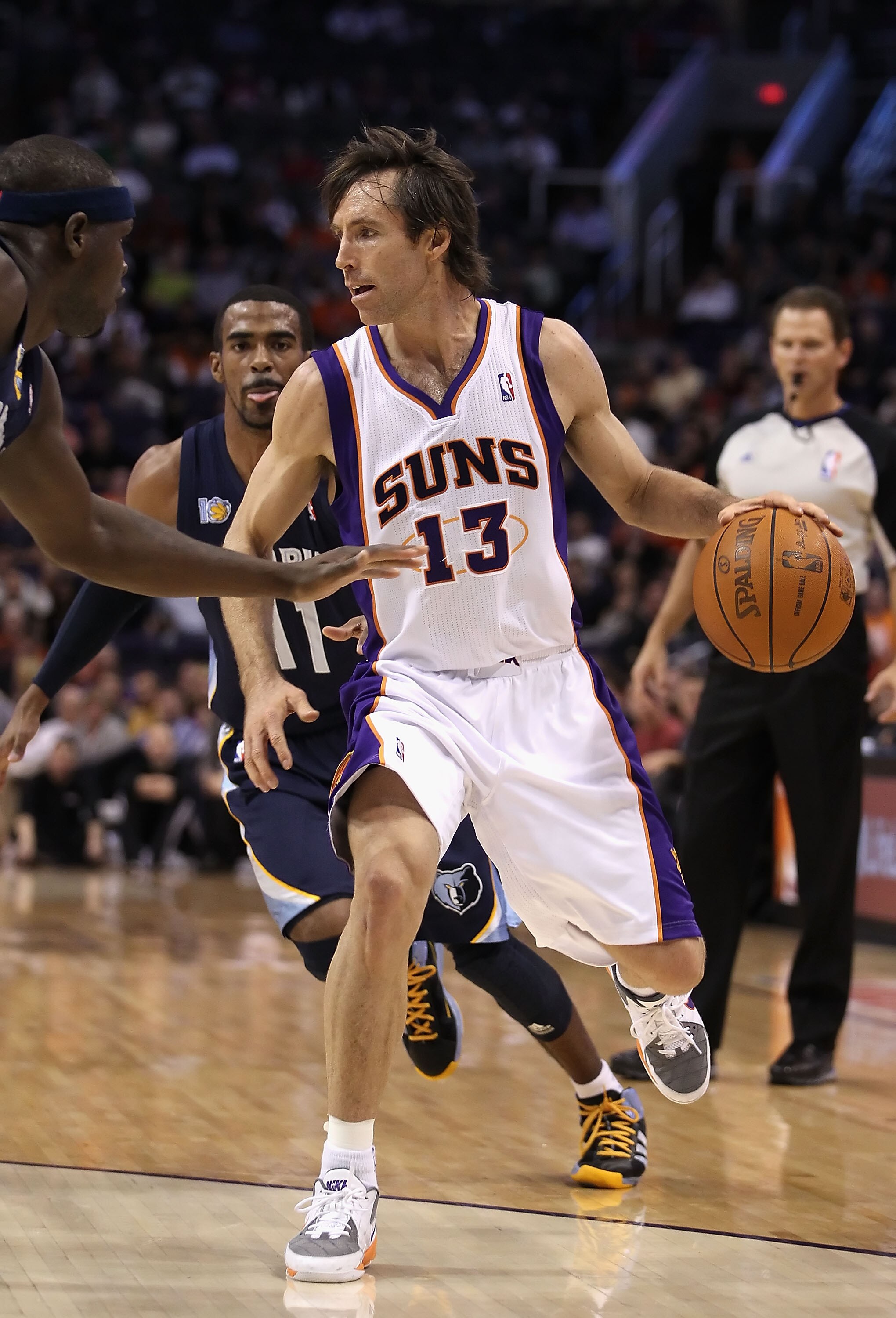 PHOENIX - DECEMBER 08:  Steve Nash #13 of the Phoenix Suns hanldes the ball during the NBA game against the Memphis Grizzlies at US Airways Center on December 8, 2010 in Phoenix, Arizona. NOTE TO USER: User expressly acknowledges and agrees that, by downl