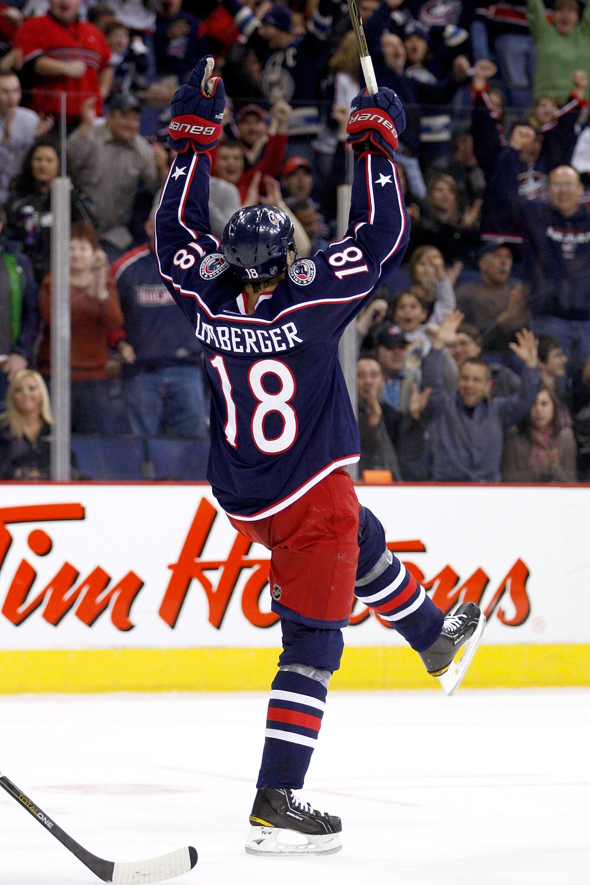COLUMBUS,OH - DECEMBER 11:  R.J. Umberger #18 of the Columbus Blue Jackets celebrates after his teammate Antoine Vermette #50 of the Columbus Blue Jackets scored a power play goal against the New York Rangers on December 11, 2010 at Nationwide Arena in Co