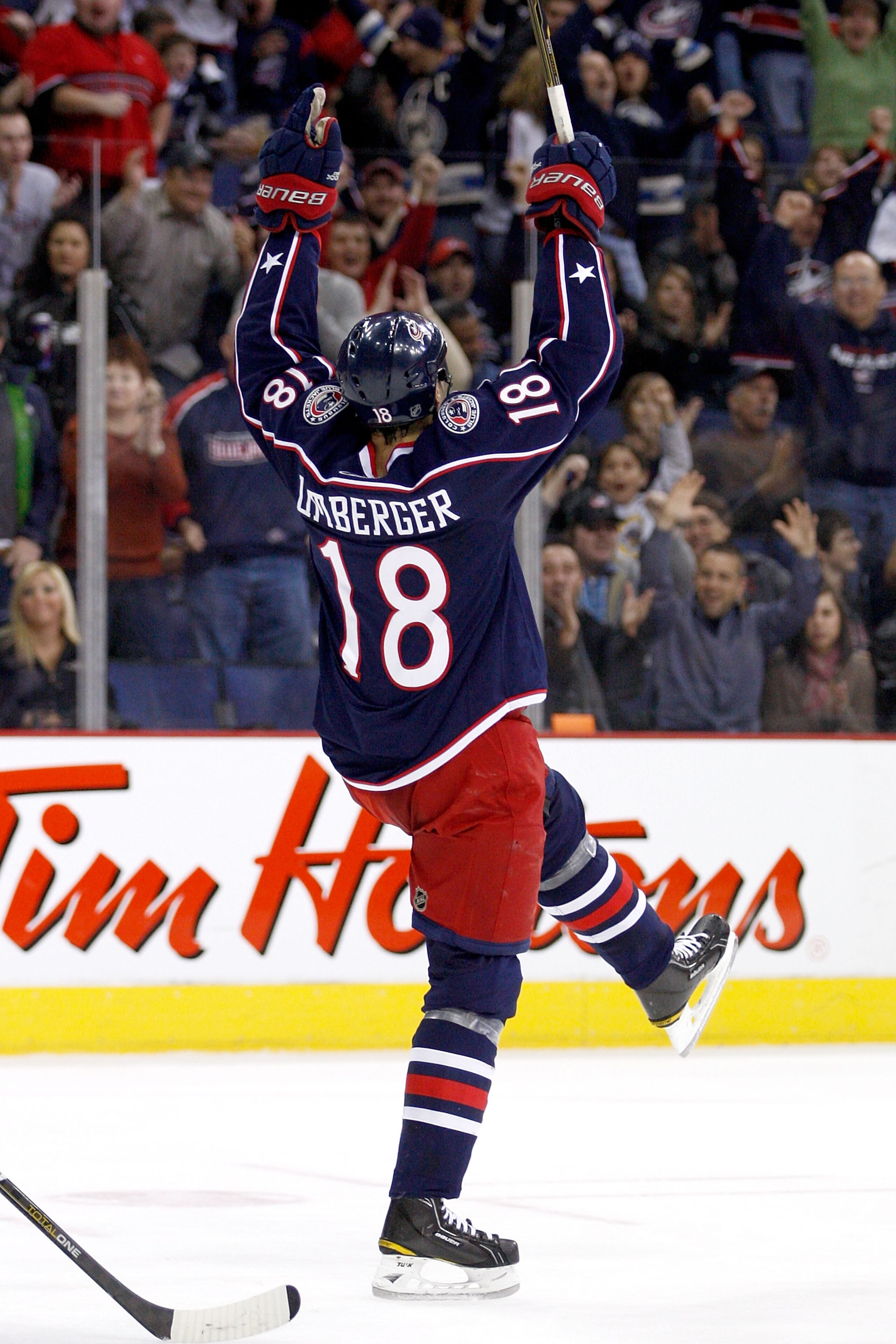 COLUMBUS,OH - DECEMBER 11:  R.J. Umberger #18 of the Columbus Blue Jackets celebrates after his teammate Antoine Vermette #50 of the Columbus Blue Jackets scored a power play goal against the New York Rangers on December 11, 2010 at Nationwide Arena in Co