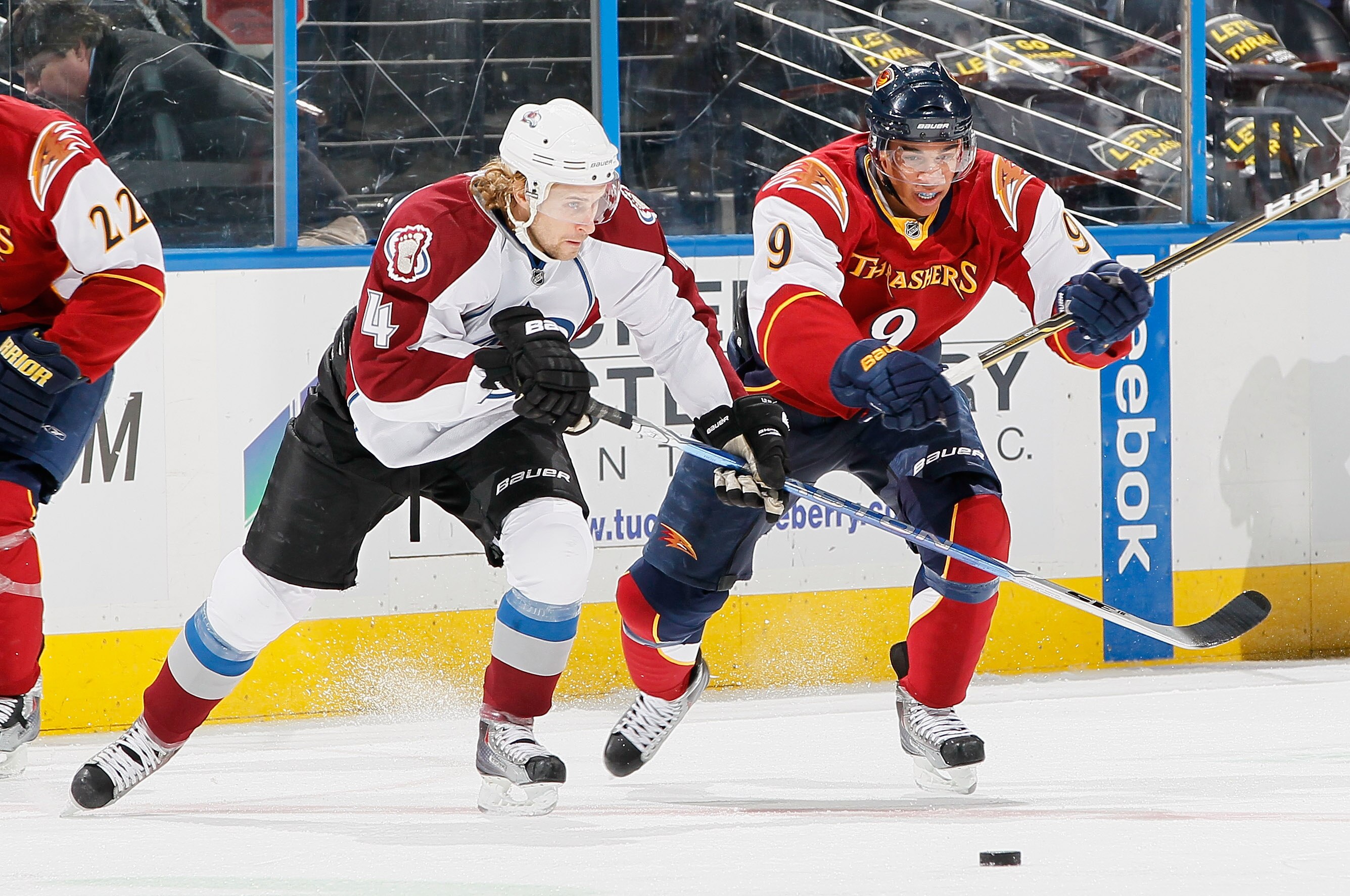 ATLANTA, GA - DECEMBER 10:  Evander Kane #9 of the Atlanta Thrashers against John-Michael Liles #4 of the Colorado Avalanche at Philips Arena on December 10, 2010 in Atlanta, Georgia.  (Photo by Kevin C. Cox/Getty Images)