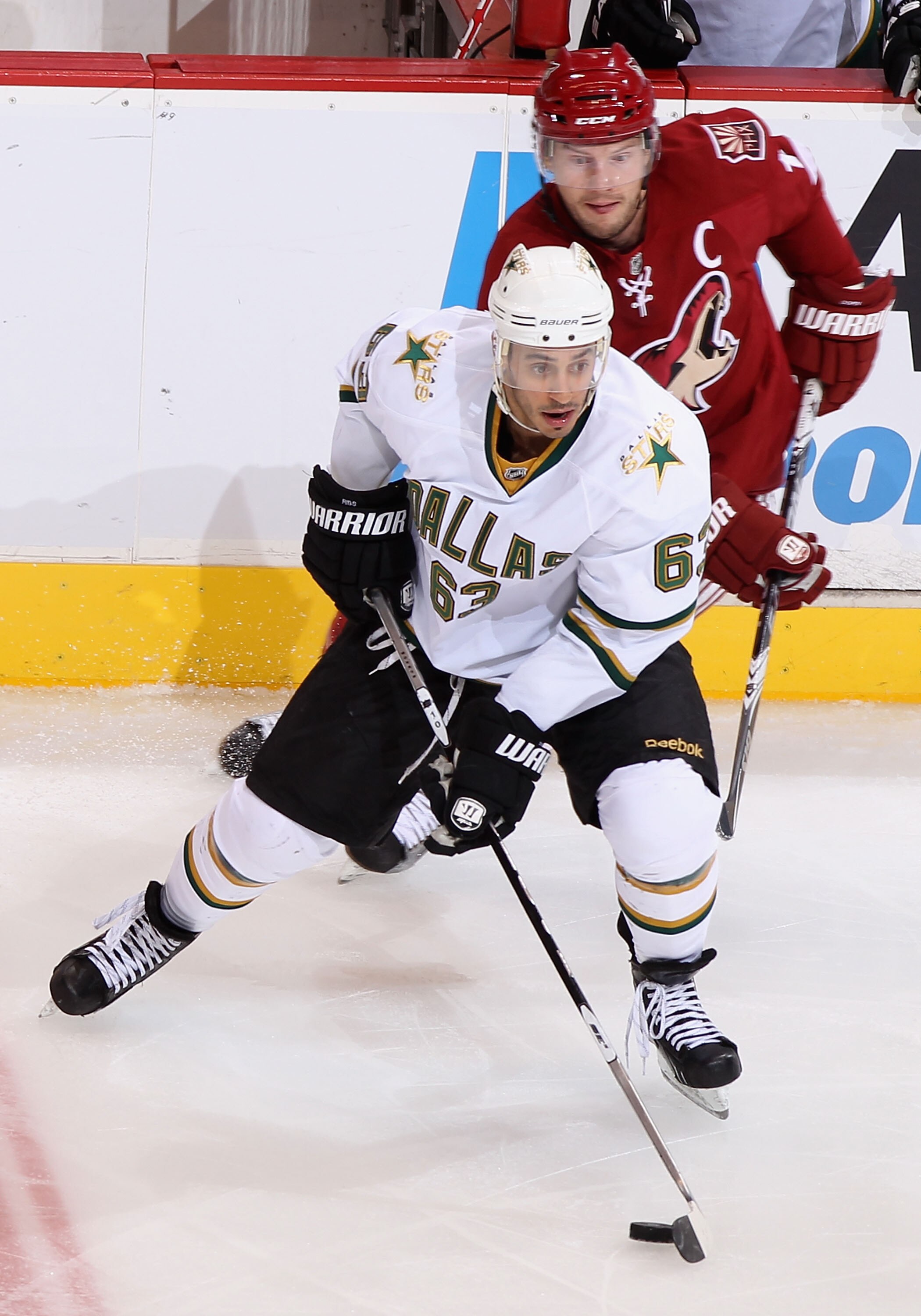 GLENDALE, AZ - DECEMBER 11:  Mike Ribeiro #63 of the Dallas Stars skates with the puck past Shane Doan #19 of the Phoenix Coyotes during the NHL game at Jobing.com Arena on December 11, 2010 in Glendale, Arizona. The Coyotes defeated the Stars 5-2. (Photo