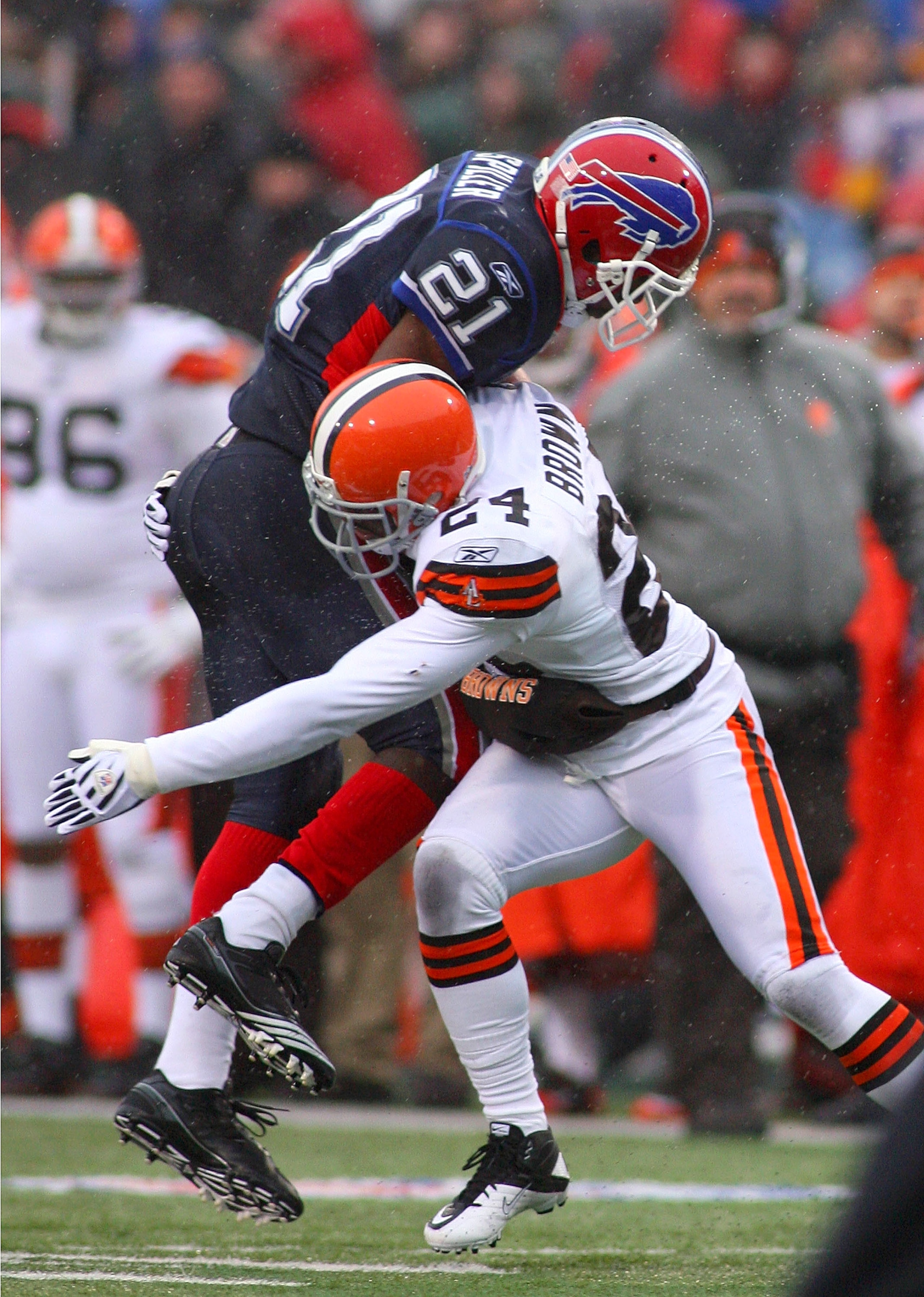 ORCHARD PARK, NY - DECEMBER 12: C.J. Spiller #21 of the Buffalo Bills is tackled by Sheldon Brown #24 of the Cleveland Browns  at Ralph Wilson Stadium on December 12, 2010 in Orchard Park, New York.  Buffalo won 13-6.(Photo by Rick Stewart/Getty Images)