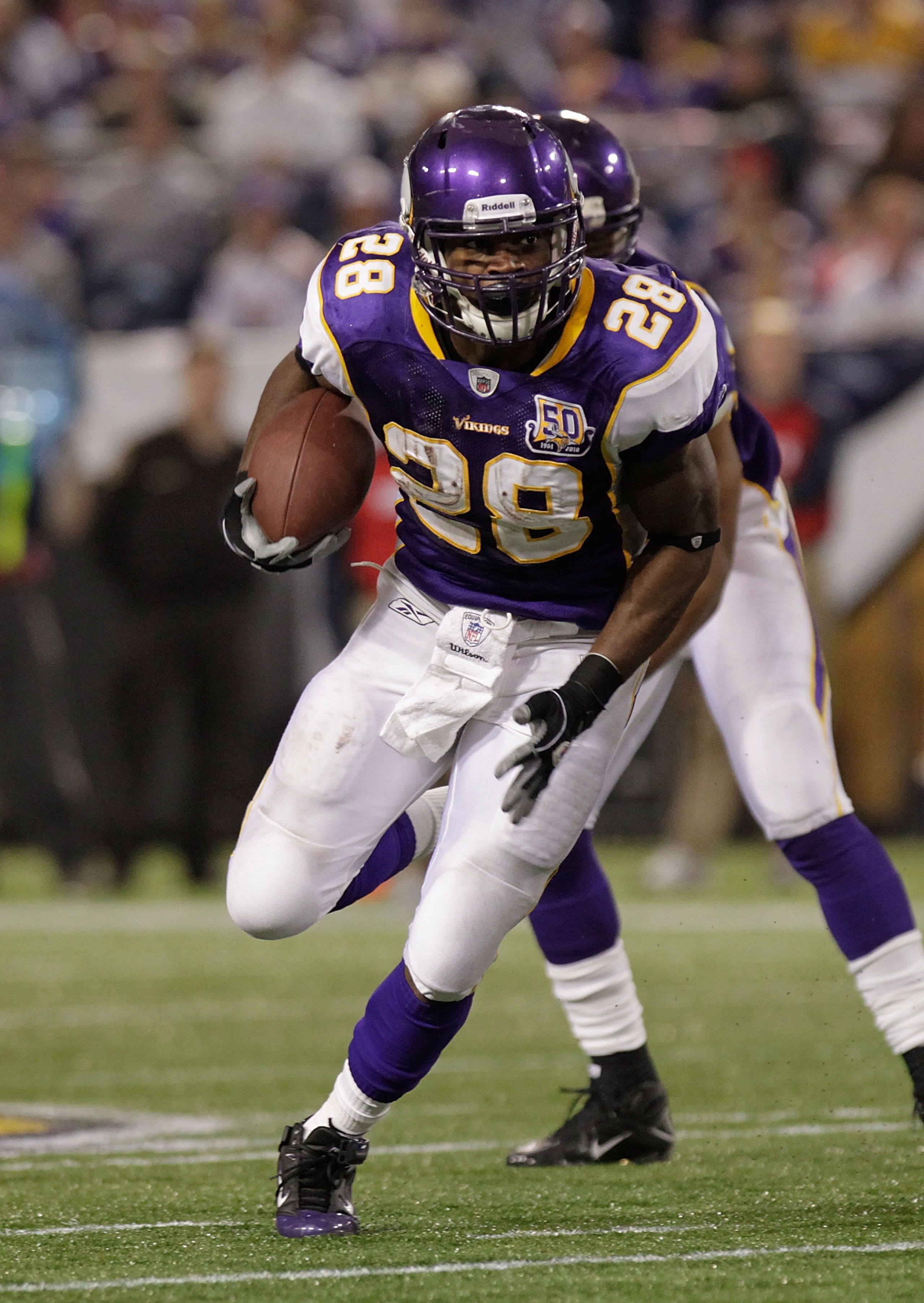MINNEAPOLIS, MN - DECEMBER 05:  Adrian Peterson #28 of the Minnesota Vikings rushes against  the Buffalo Bills at the Mall of America Field at the Hubert H. Humphrey Metrodome on December 5, 2010 in Minneapolis, Minnesota.  (Photo by Nick Laham/Getty Imag