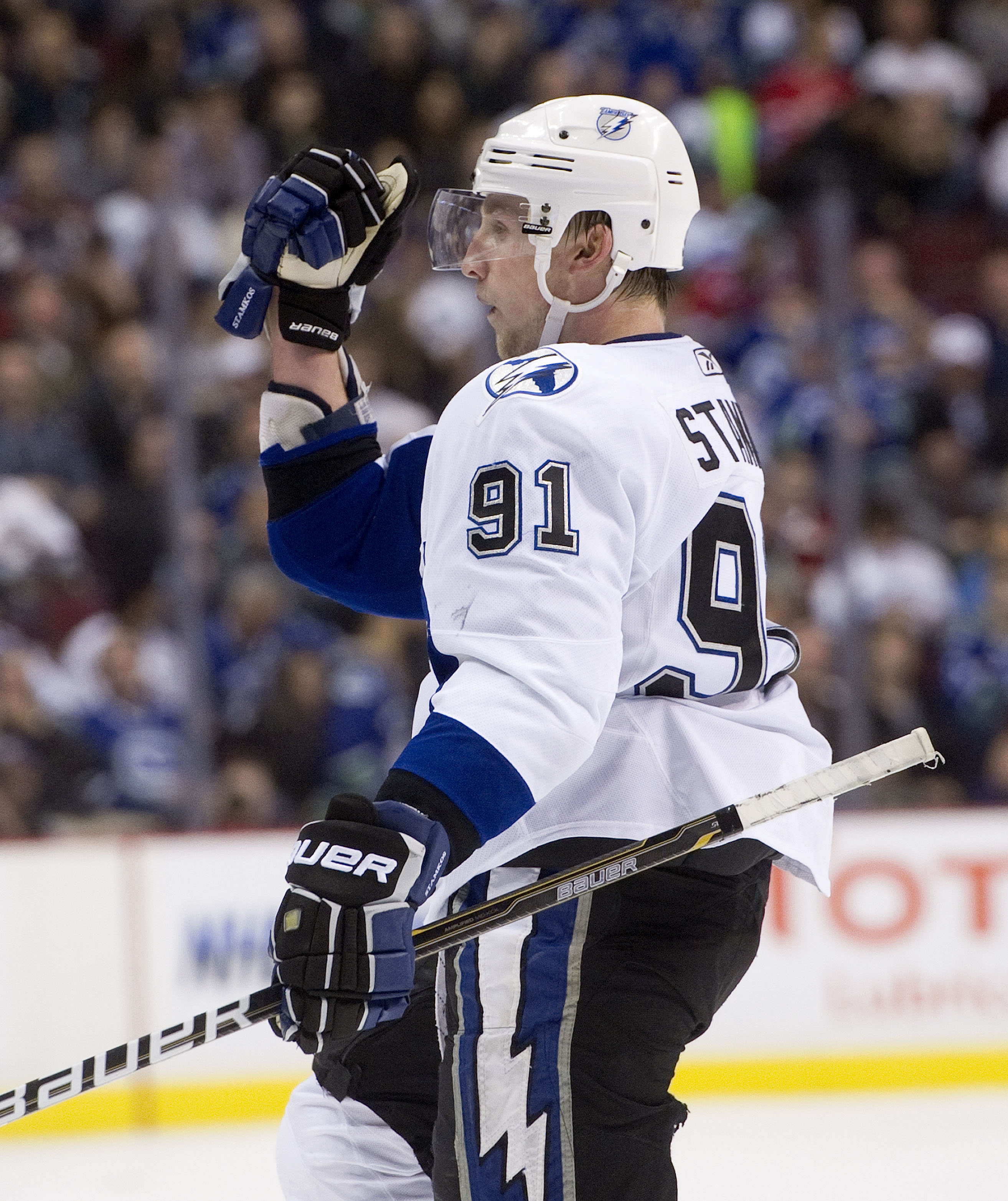 VANCOUVER, CANADA - DECEMBER 11: Steven Stamkos #91 of the Tampa Bay Lightning celebrates after scoring against the Vancouver Canucks in overtime to win 5-4 during NHL action on December 11, 2010 at Rogers Arena in Vancouver, BC, Canada.  (Photo by Rich L