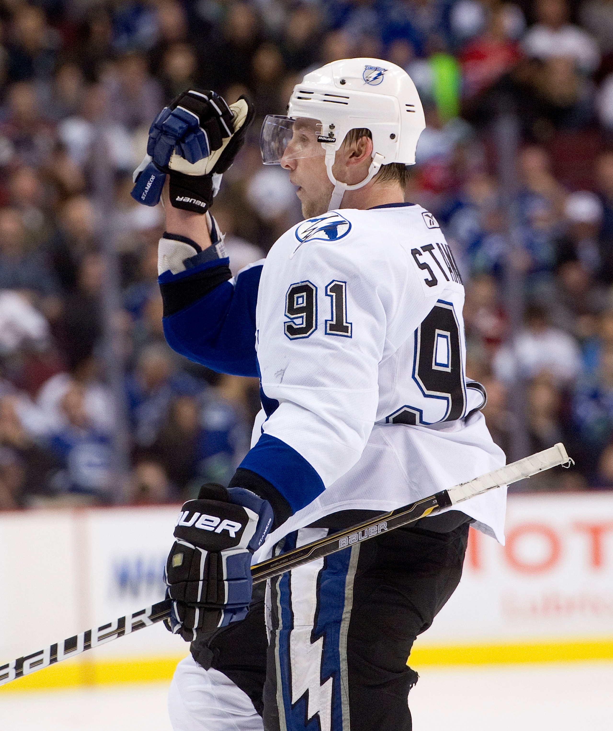 VANCOUVER, CANADA - DECEMBER 11: Steven Stamkos #91 of the Tampa Bay Lightning celebrates after scoring against the Vancouver Canucks in overtime to win 5-4 during NHL action on December 11, 2010 at Rogers Arena in Vancouver, BC, Canada.  (Photo by Rich L