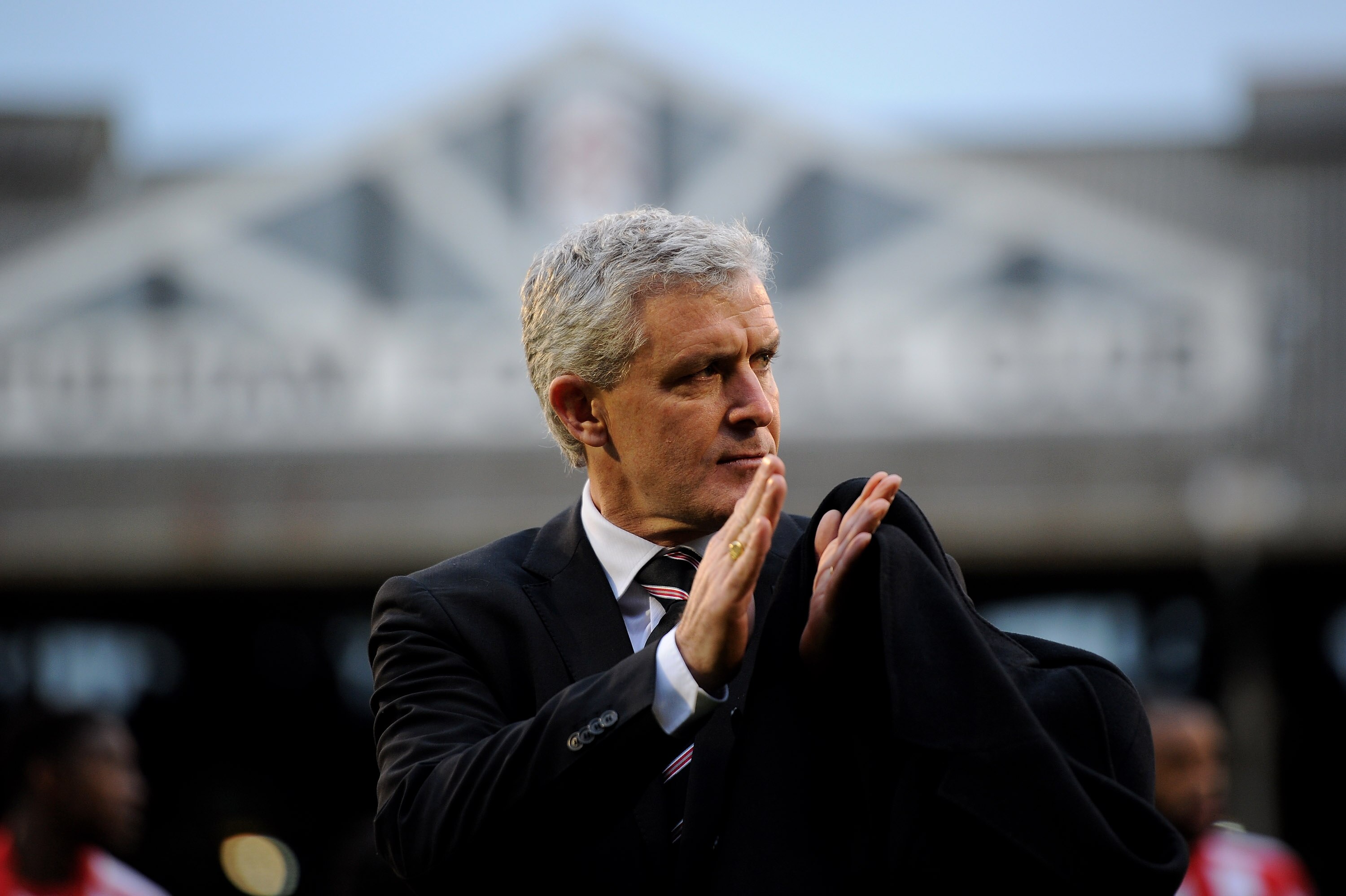 LONDON, ENGLAND - DECEMBER 11:  Mark Hughes manager of Fulham applauds the fans ahead of the Barclays Premier League match between Fulham and Sunderland at Craven Cottage on December 11, 2010 in London, England.  (Photo by Clive Mason/Getty Images)
