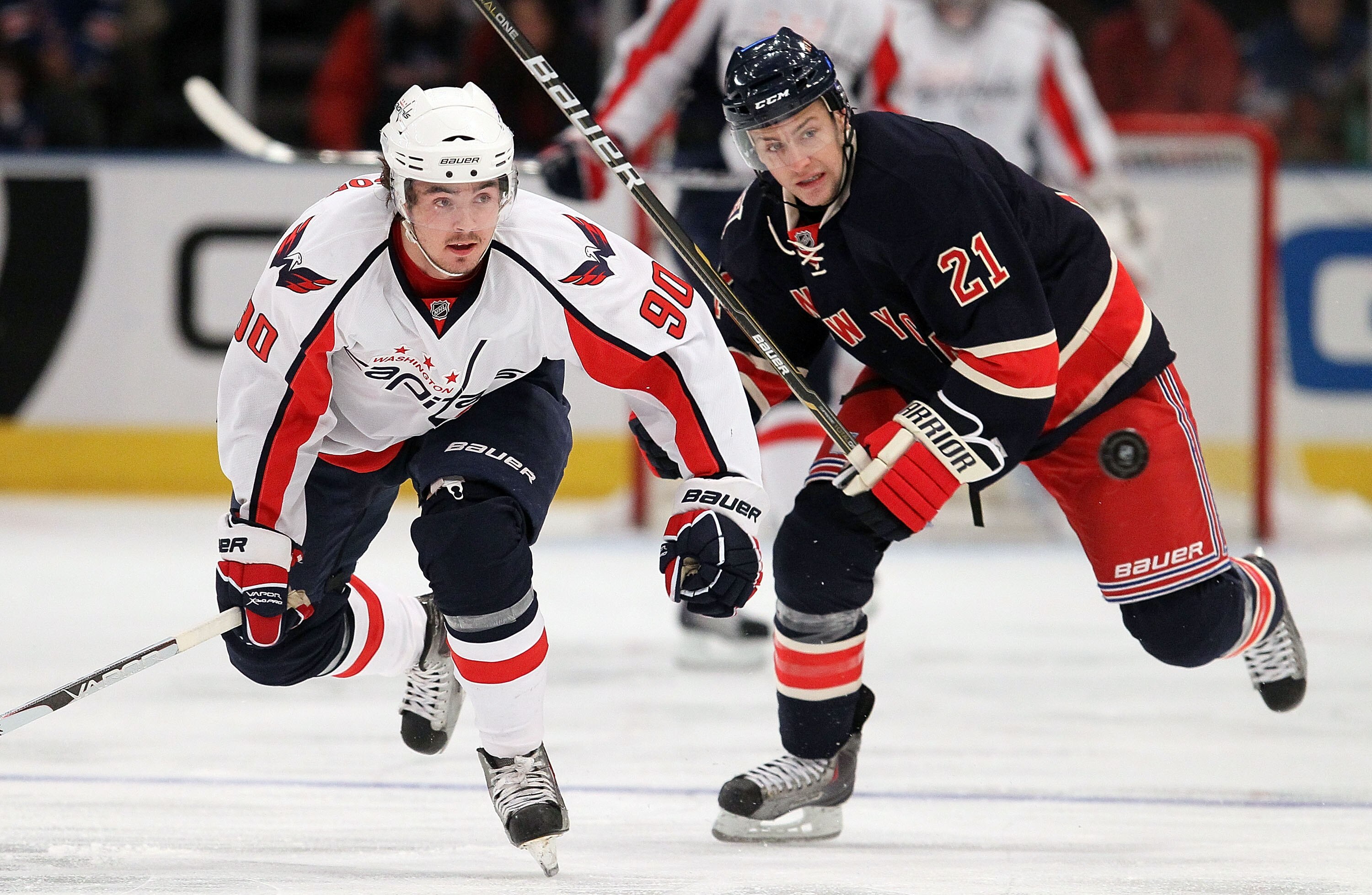 NEW YORK, NY - DECEMBER 12:  Marcus Johansson #90 of the Washington Capitals skates against Derek Stepan #21 of the New York Rangers on December 12, 2010 at Madison Square Garden in New York City.  (Photo by Jim McIsaac/Getty Images)
