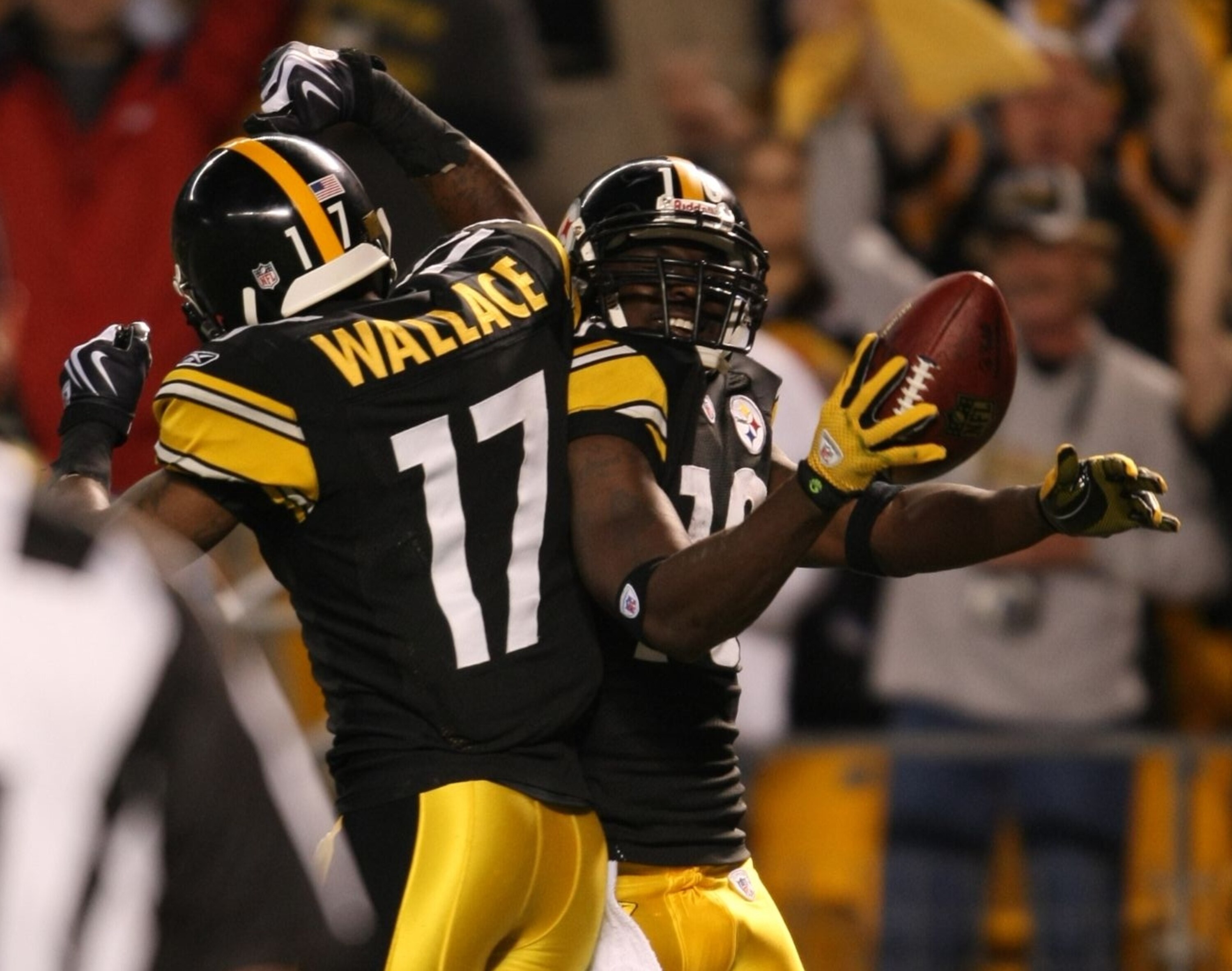 PITTSBURGH - SEPTEMBER 10:  Wide receiver Santonio Holmes #10 of the Pittsburgh Steelers celebrates his touchdown in the second quarter with teammate Mike Wallace #17 during the NFL season opener against the Tennessee Titans at Heinz Field on September 10
