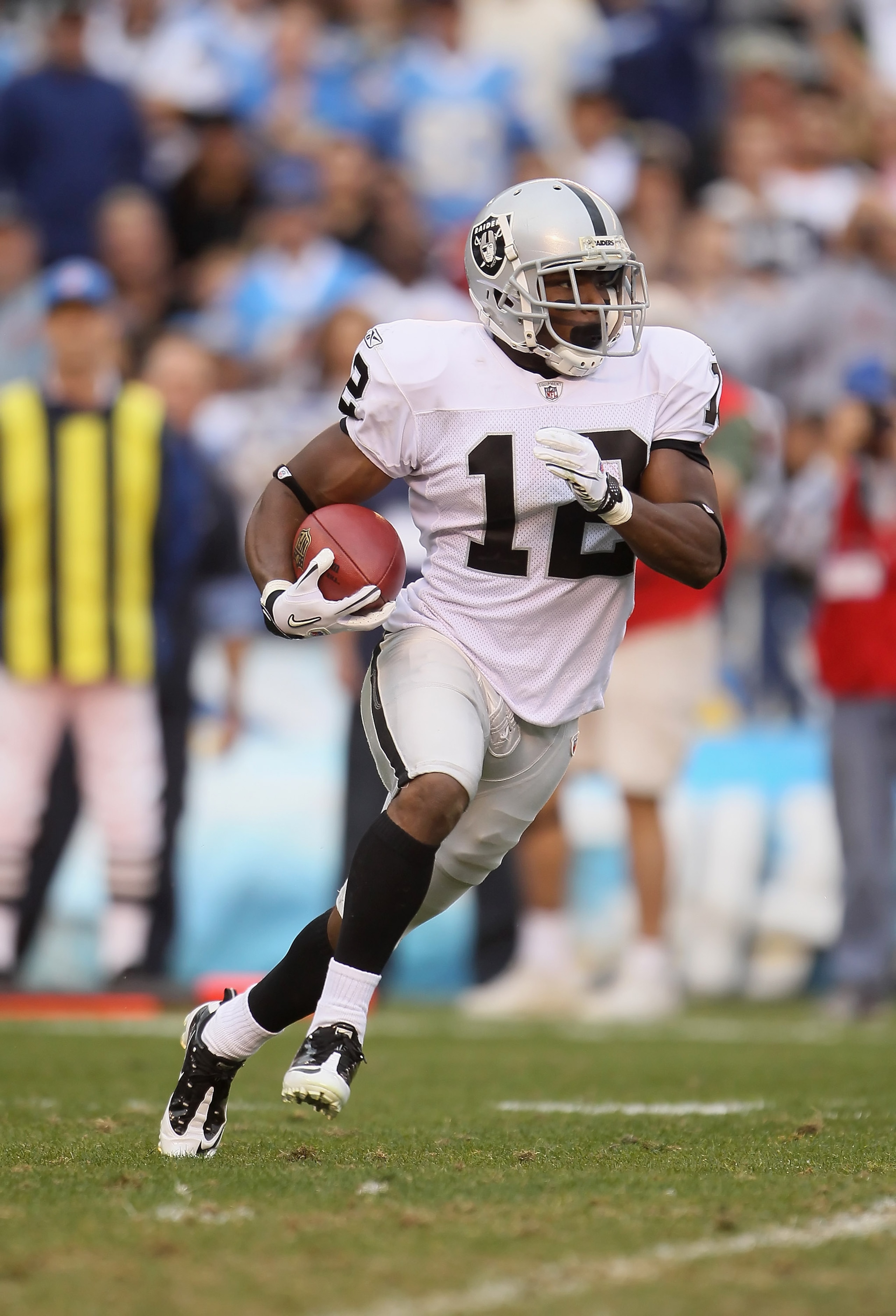 SAN DIEGO - DECEMBER 05:  Jacoby Ford #12 the Oakland Raiders carries the ball against the San Diego Chargers at Qualcomm Stadium on December 5, 2010 in San Diego, California. The Raiders defeated the Chargers 28-13.  (Photo by Jeff Gross/Getty Images)