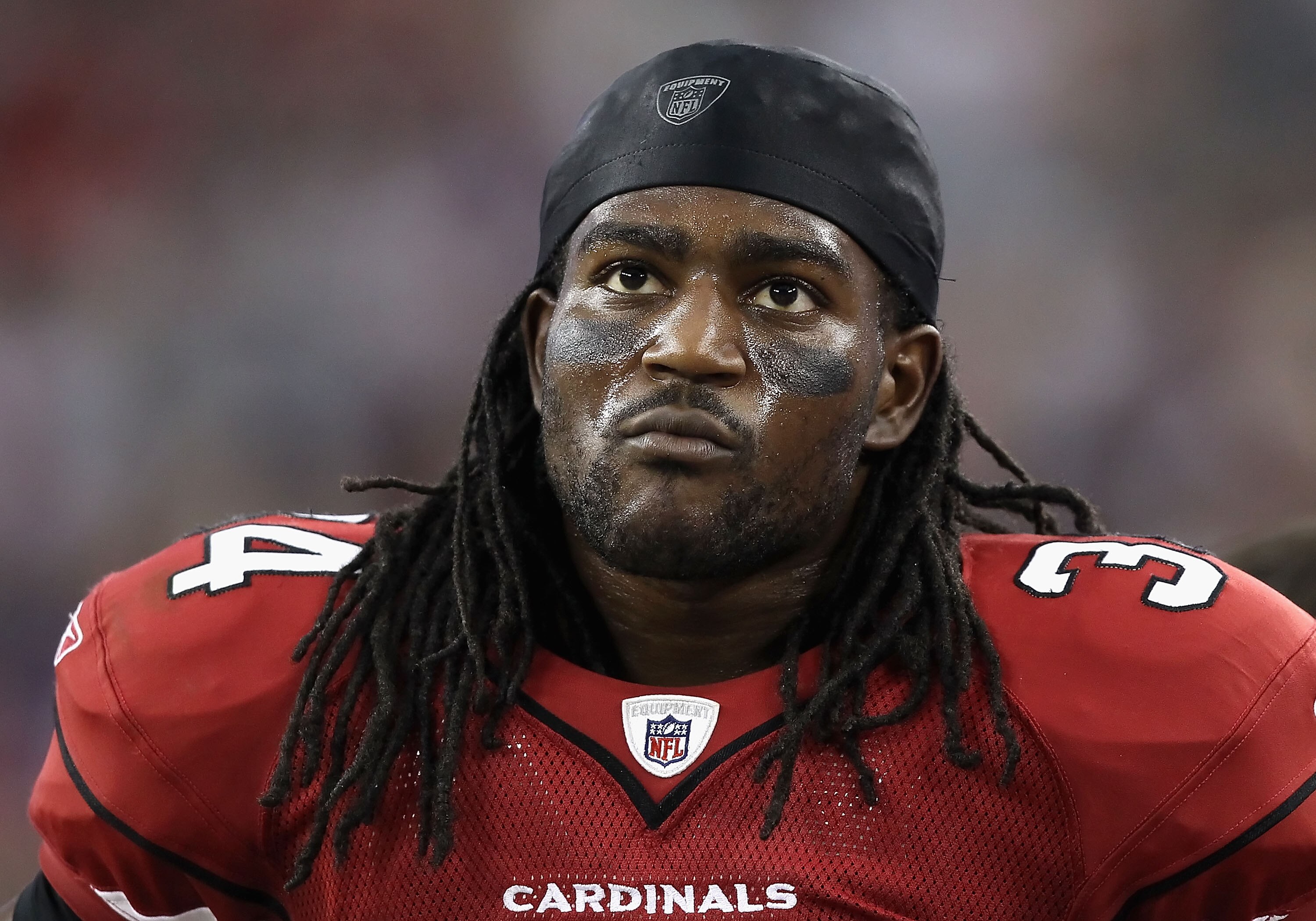 GLENDALE, AZ - DECEMBER 12:  Runningback Tim Hightower #34 of the Arizona Cardinals stands on the sidelines during the NFL game against the Denver Broncos at the University of Phoenix Stadium on December 12, 2010 in Glendale, Arizona.  The Cardinals defea