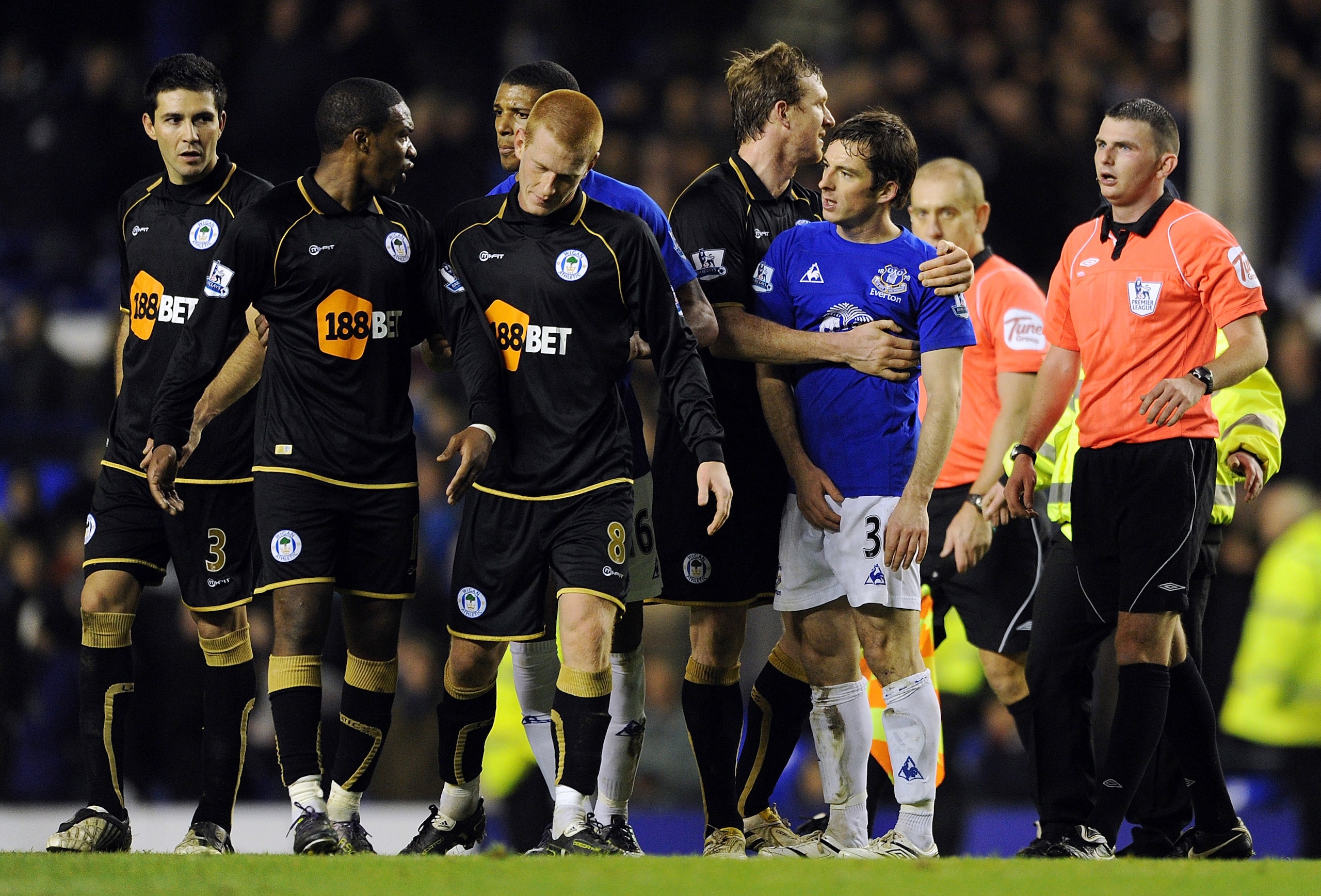 LIVERPOOL, ENGLAND - DECEMBER 11:  Leighton Baines #3 of Everton clashes with Charles N'Zogbia (2nd L) of Wigan Athletic following the Barclays Premier League match between Everton and Wigan Athletic at Goodison Park on December 11, 2010 in Liverpool, Eng