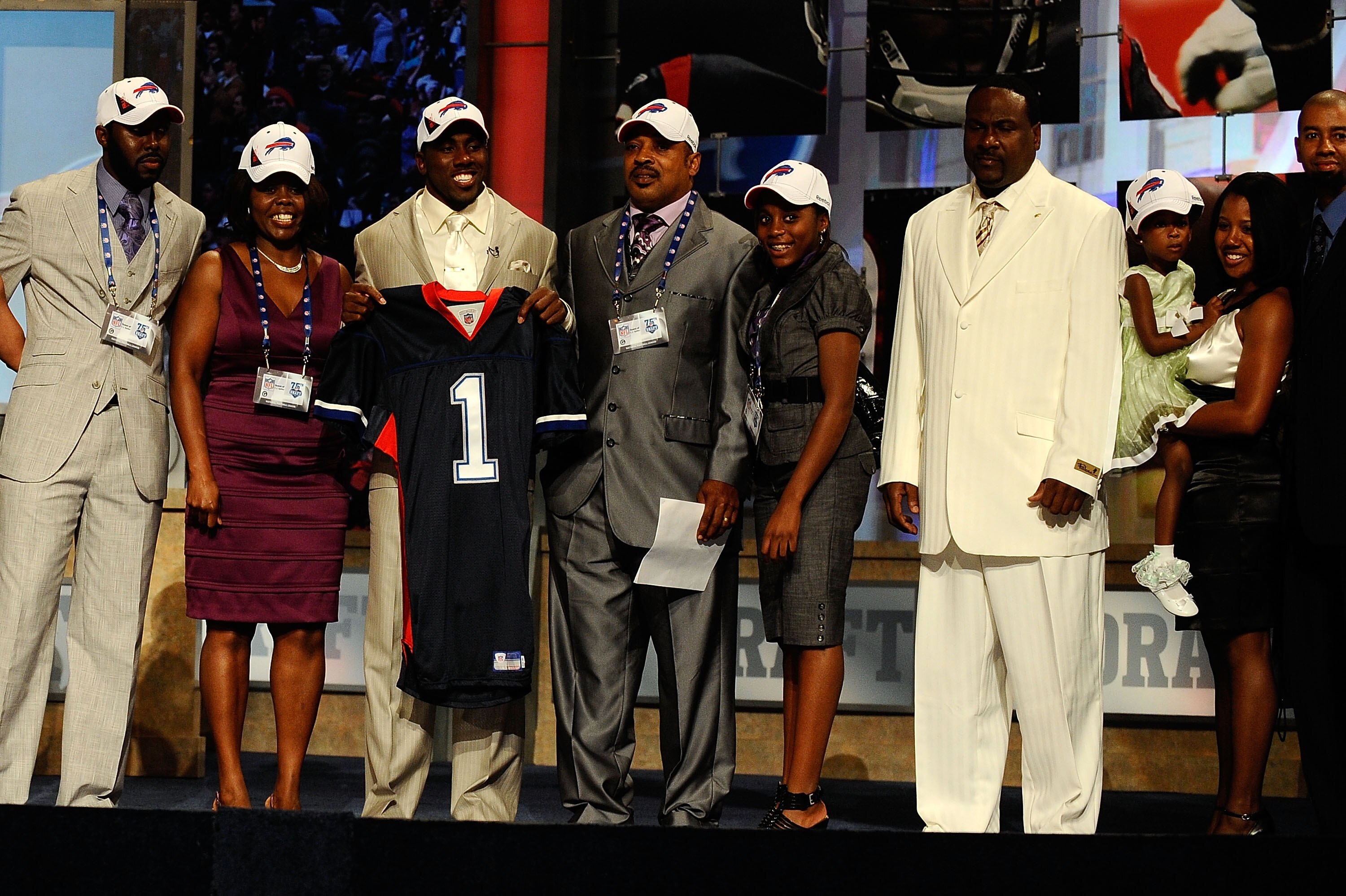 NEW YORK - APRIL 22:  C.J. Spiller from the Clemson Tigers holds up a Buffalo Bills jersey as he poses with friends and family after he was selected number 9 overall by the Bills during the first round of the 2010 NFL Draft at Radio City Music Hall on Apr