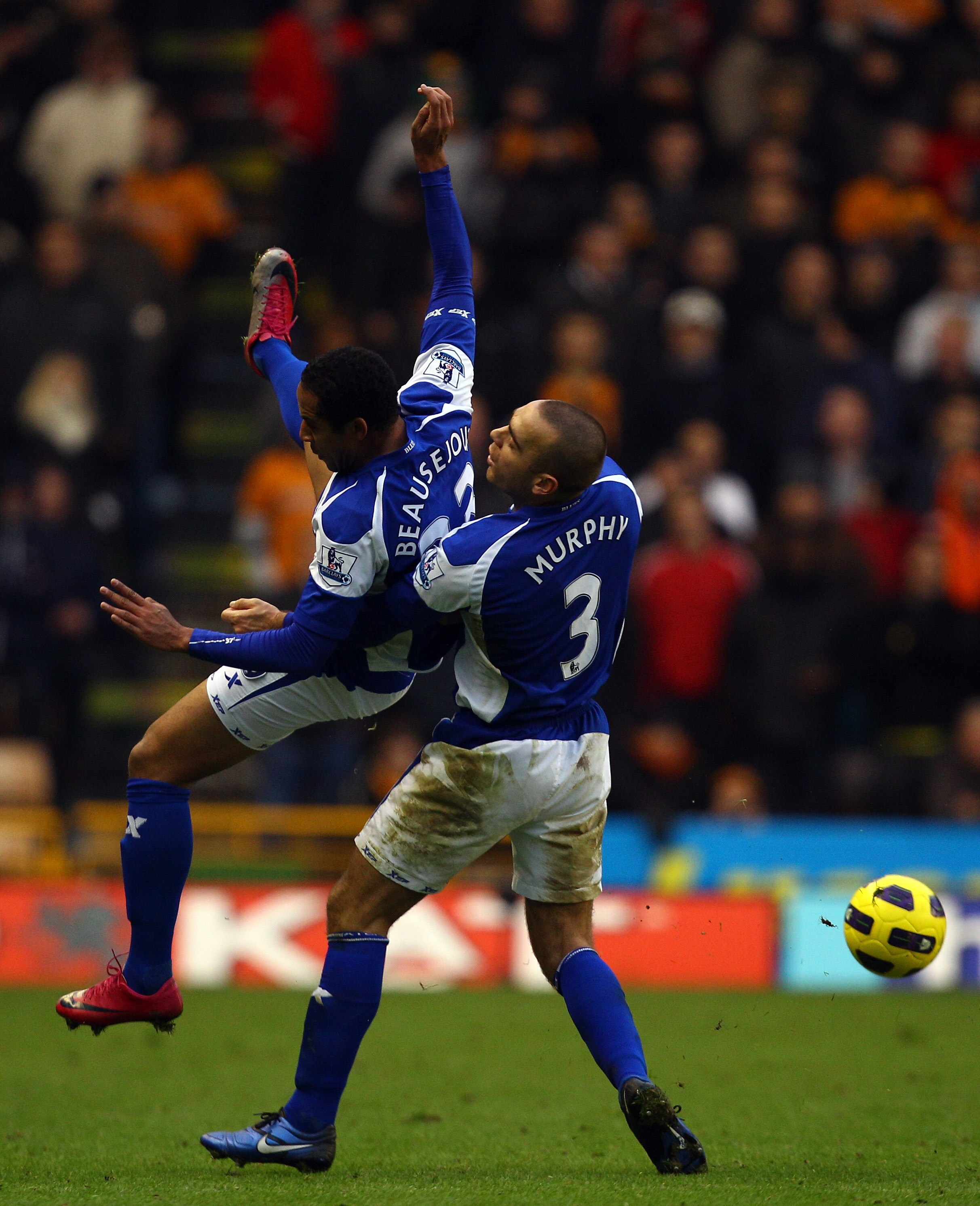 WOLVERHAMPTON, ENGLAND - DECEMBER 12:  Jean Beausejour and David Murphy of Birmingham tackle each other during the Barclays Premier League match between Wolverhampton Wanderers and Birmingham City at Molineux on December 12, 2010 in Wolverhampton, England