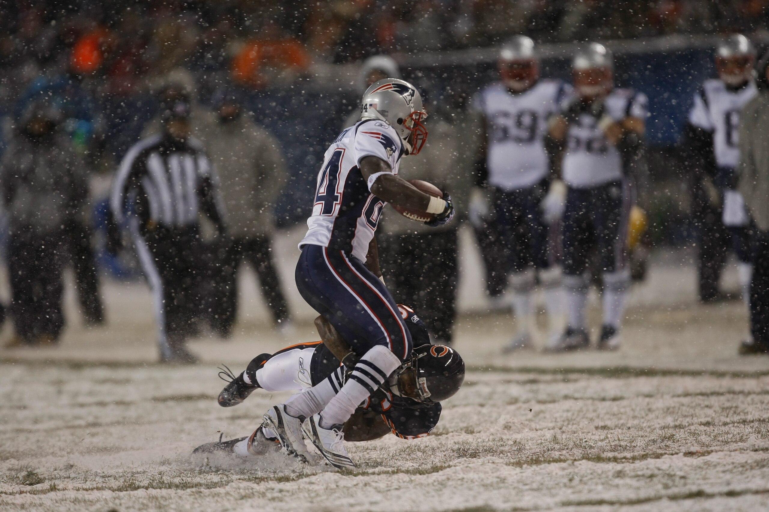 CHICAGO, IL - DECEMBER 12: Deion Branch #84 of the New England Patriots runs against the Chicago Bears at Soldier Field on December 12, 2010 in Chicago, Illinois. The Patriots defeated the Bears 36-7. (Photo by Scott Boehm/Getty Images)