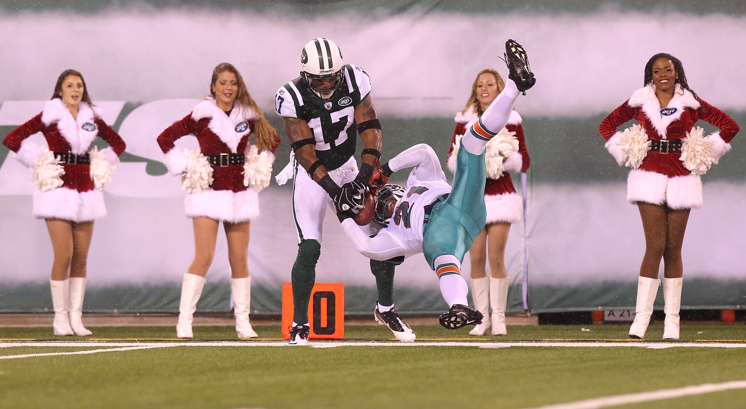 EAST RUTHERFORD, NJ - DECEMBER 12: Braylon Edwards #17 of the New York Jets has his reception broken up by Vontae Davis #21 of the Miami Dolphins at New Meadowlands Stadium on December 12, 2010 in East Rutherford, New Jersey.  (Photo by Nick Laham/Getty I