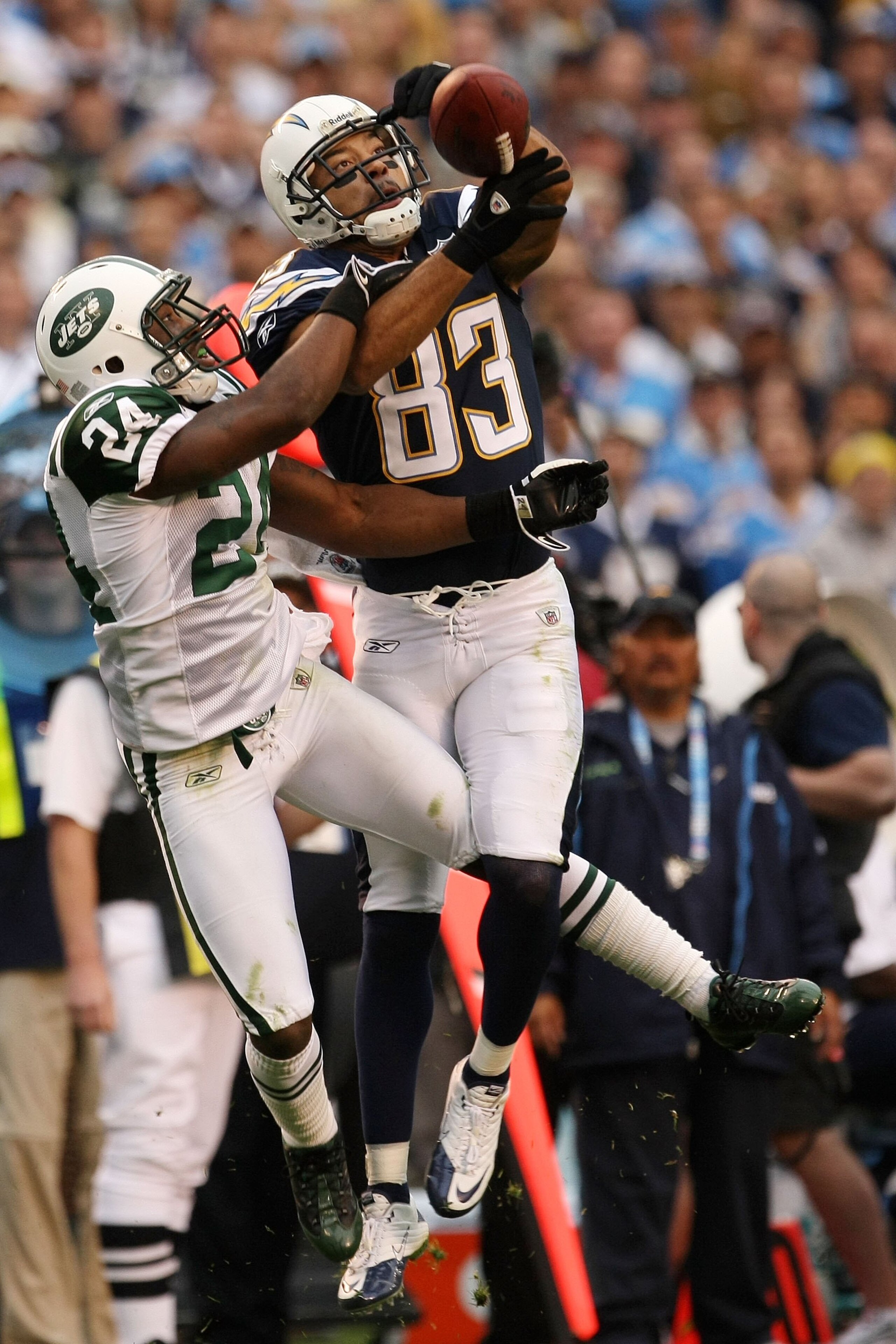 SAN DIEGO - JANUARY 17:  Wide receiver Vincent Jackson #83 of the San Diego Chargers goes up for a catch against Darrelle Revis #24 of the New York Jets during  AFC Divisional Playoff Game at Qualcomm Stadium on January 17, 2010 in San Diego, California.