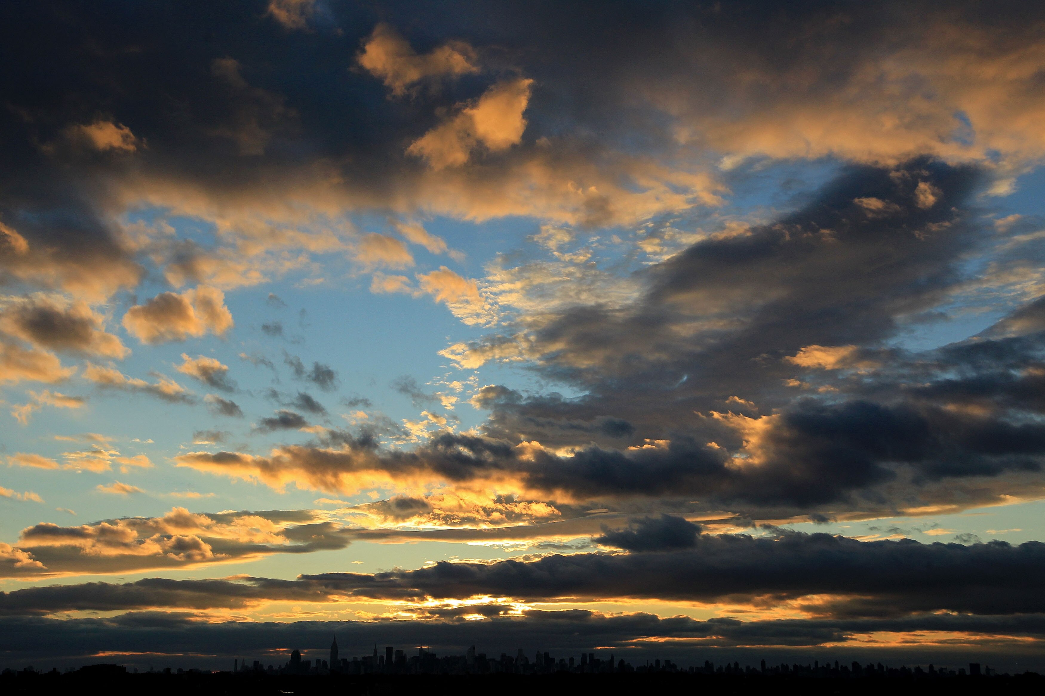 NEW YORK - SEPTEMBER 09:  The sunsets over the Manhattan skyline during day eleven of the 2010 U.S. Open at the USTA Billie Jean King National Tennis Center on September 9, 2010 in the Flushing neighborhood of the Queens borough of New York City.  (Photo 