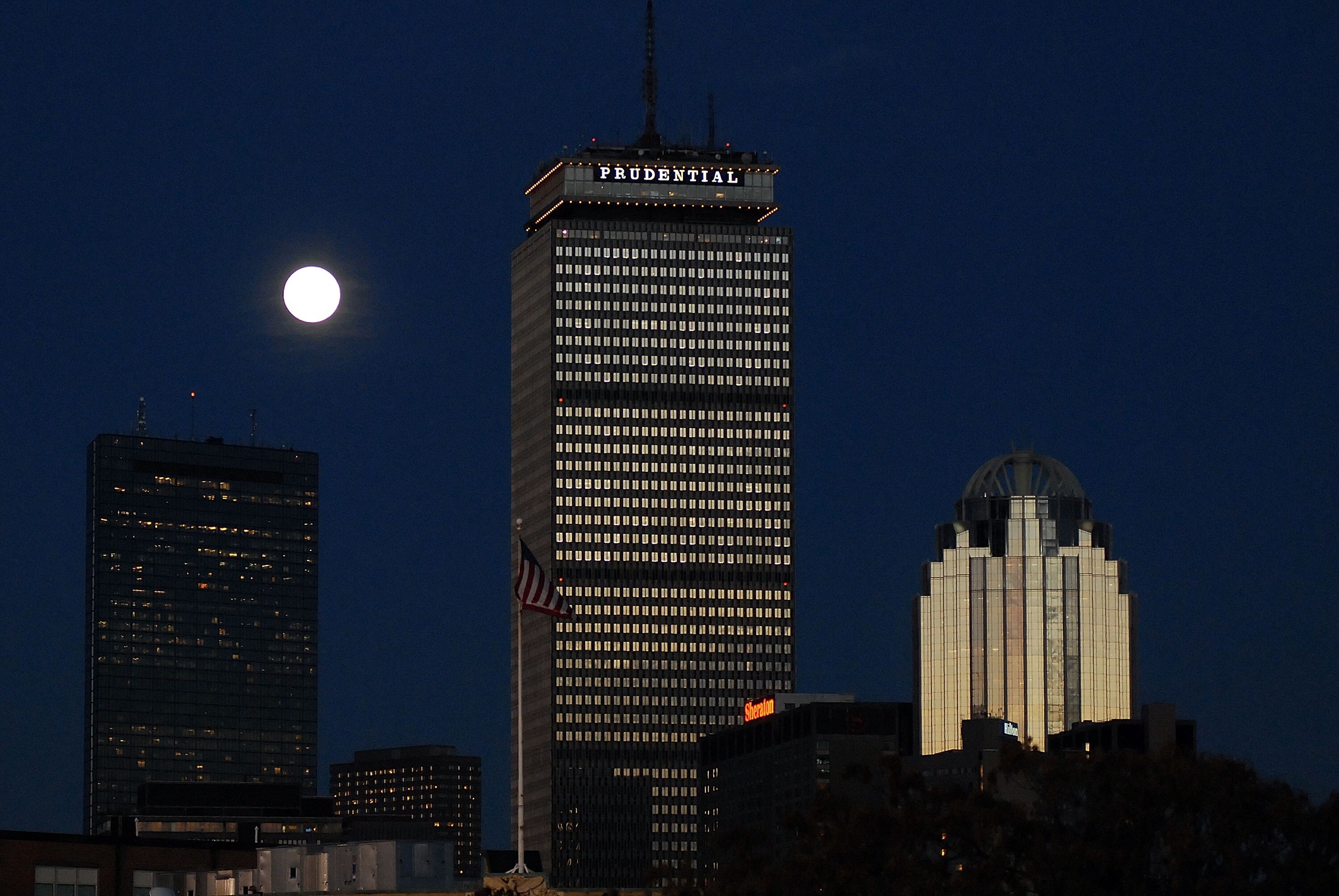 BOSTON - OCTOBER 25:  A rising moon is seen behind the Prudential Building (C), part of the downtown Boston skyline, prior to Game Two of the 2007 Major League Baseball World Series at Fenway Park  between the Boston Red Sox and the Colorado Rockies on Oc