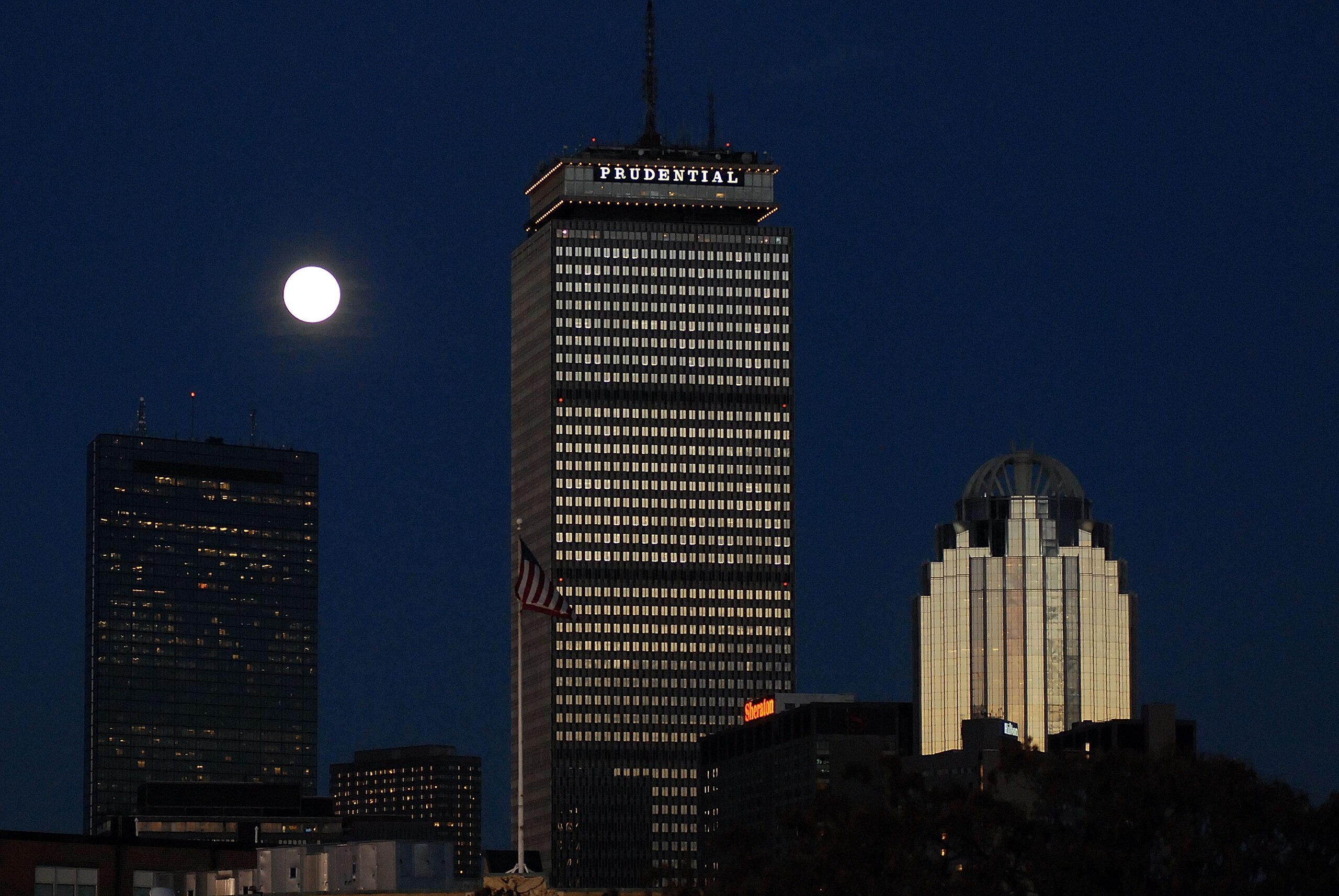 BOSTON - OCTOBER 25:  A rising moon is seen behind the Prudential Building (C), part of the downtown Boston skyline, prior to Game Two of the 2007 Major League Baseball World Series at Fenway Park  between the Boston Red Sox and the Colorado Rockies on Oc