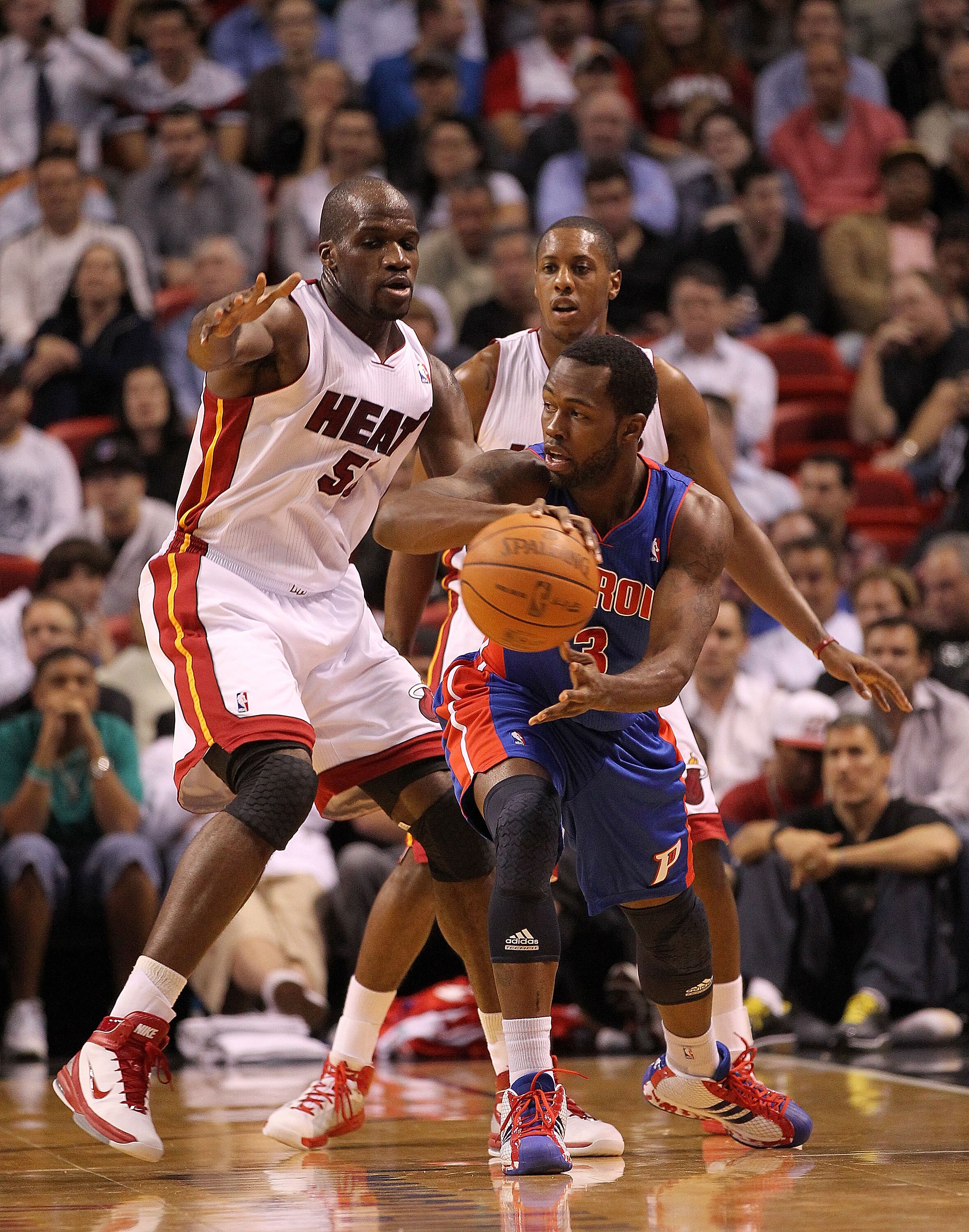 MIAMI, FL - DECEMBER 01:  Will Bynum #12 of the Detroit Pistons passes away from Joel Anthony #50 of the Miami Heat during a game at American Airlines Arena on December 1, 2010 in Miami, Florida. NOTE TO USER: User expressly acknowledges and agrees that,