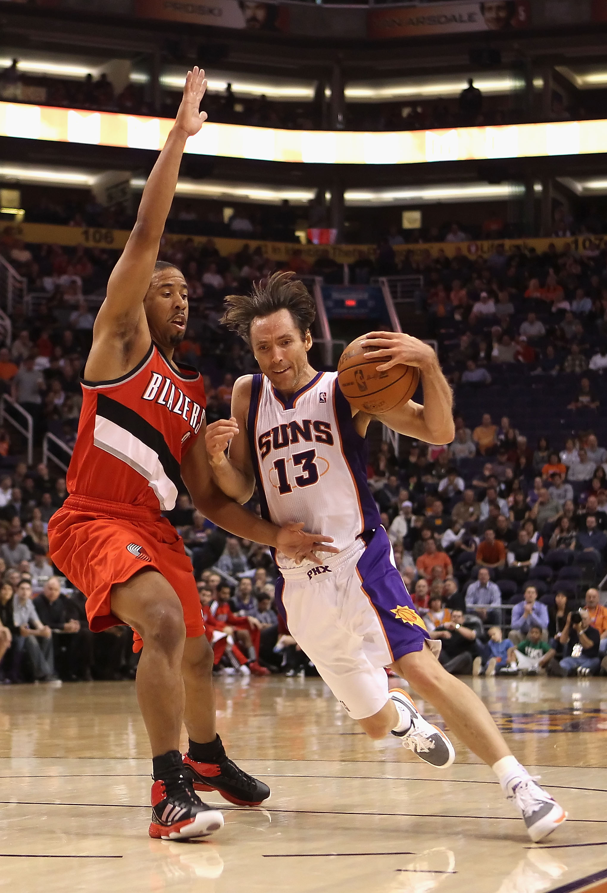 PHOENIX - DECEMBER 10:  Steve Nash #13 of the Phoenix Suns drives with the ball during the NBA game against the Portland Trail Blazers at US Airways Center on December 10, 2010 in Phoenix, Arizona. The Trail Blazers defeated the Suns 101-94.  NOTE TO USER
