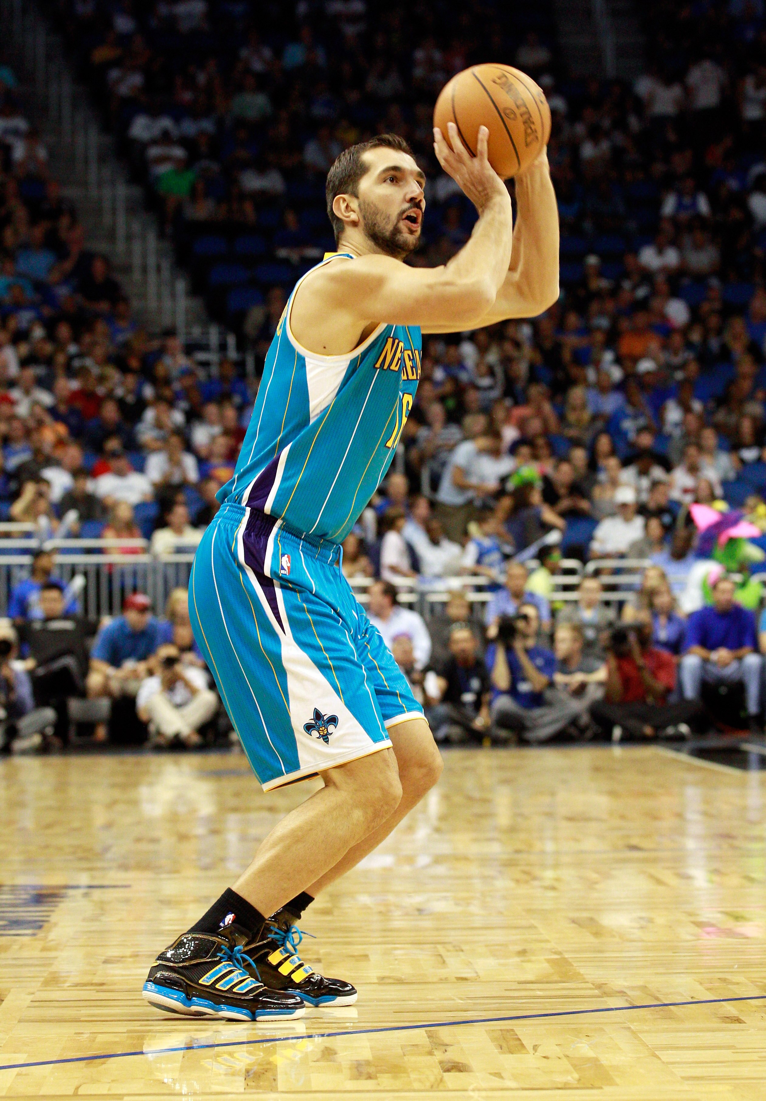 ORLANDO, FL - OCTOBER 10:  Peja Stojakovic #16 of the New Orleans Hornets attempts a shot during the game against the Orlando Magic at Amway Arena on October 10, 2010 in Orlando, Florida. NOTE TO USER: User expressly acknowledges and agrees that, by downl