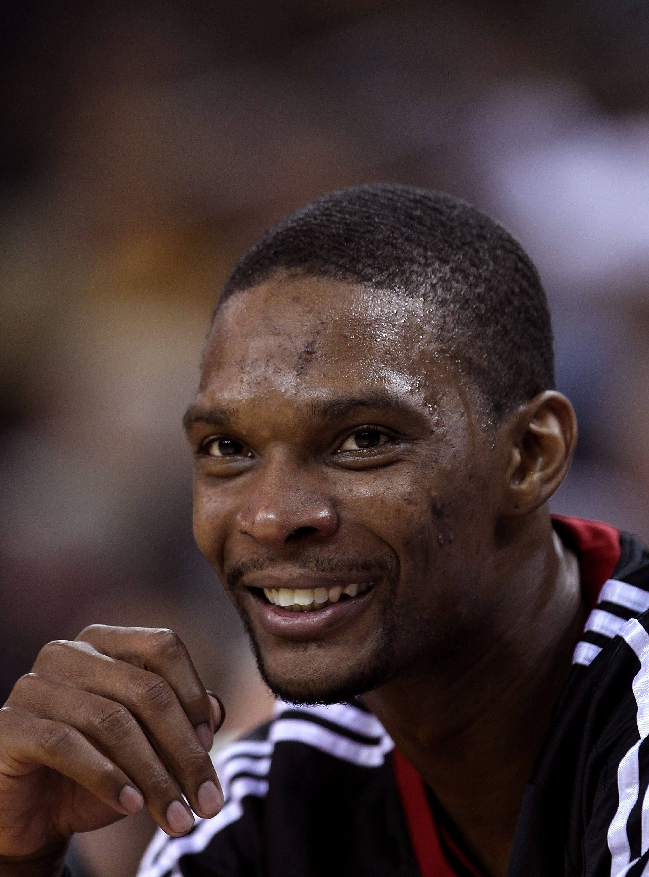 OAKLAND, CA - DECEMBER 10:  Chris Bosh #1 of the Miami Heat sits on the bench during their game against the Golden State Warriors at Oracle Arena on December 10, 2010 in Oakland, California. NOTE TO USER: User expressly acknowledges and agrees that, by do