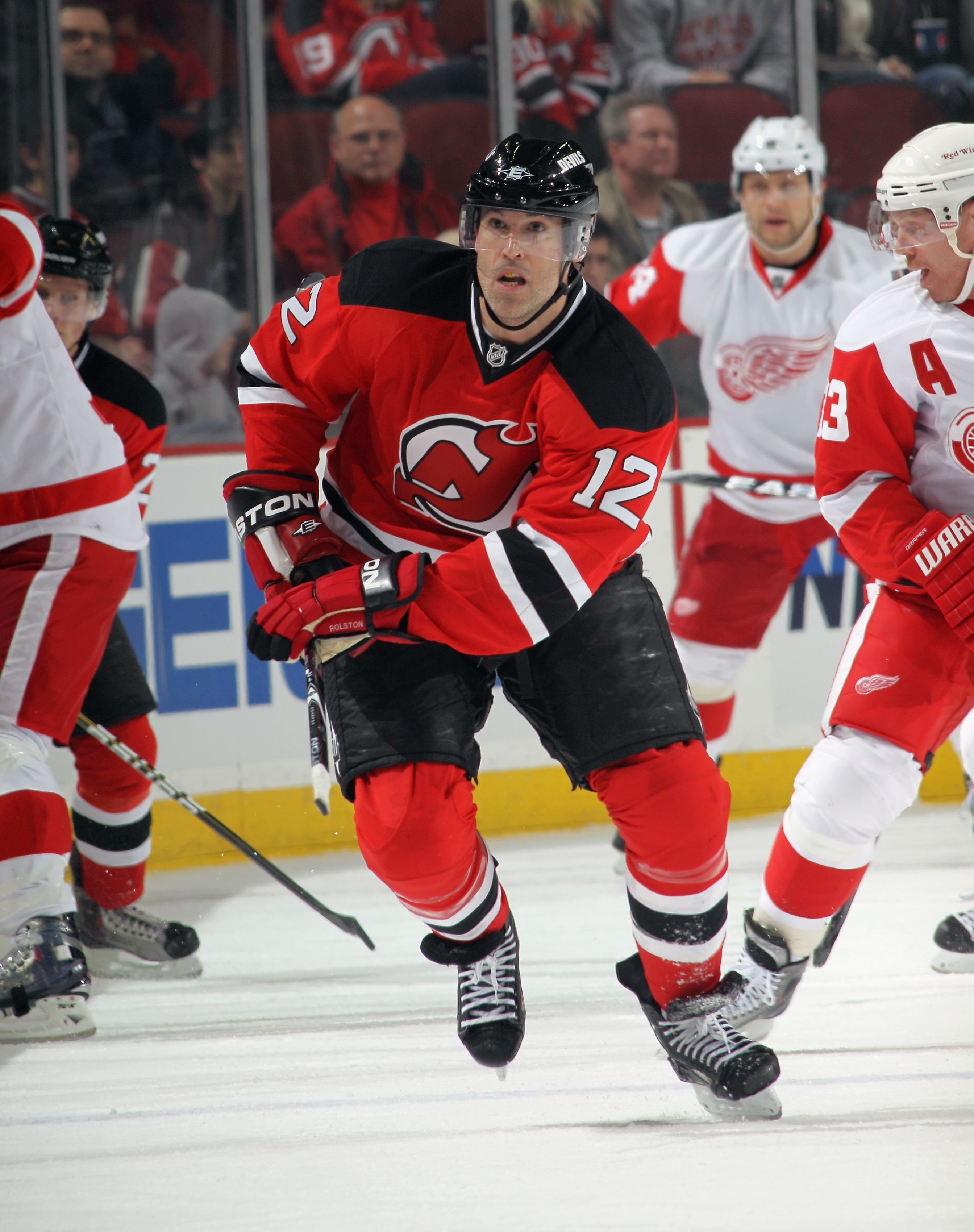 NEWARK, NJ - DECEMBER 11: Brian Rolston #12 of the New Jersey Devils skates against the Detroit Red Wings at the Prudential Center on December 11, 2010 in Newark, New Jersey. The Red Wings defeated the the Devils 4-1.  (Photo by Bruce Bennett/Getty Images