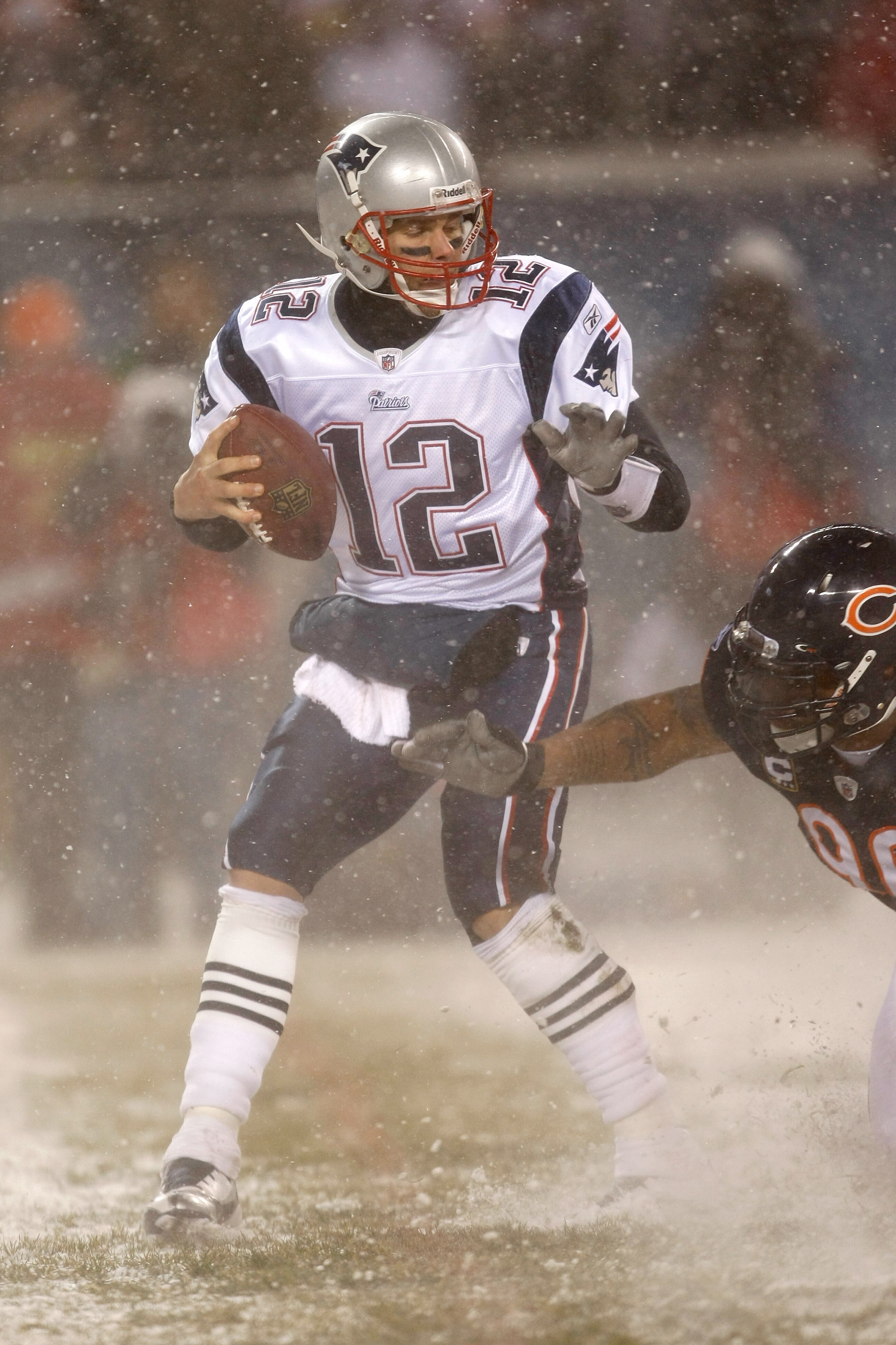 CHICAGO, IL - DECEMBER 12: Tom Brady #12 of the New England Patriots runs against the Chicago Bears at Soldier Field on December 12, 2010 in Chicago, Illinois. The Patriots defeated the Bears 36-7. (Photo by Scott Boehm/Getty Images)