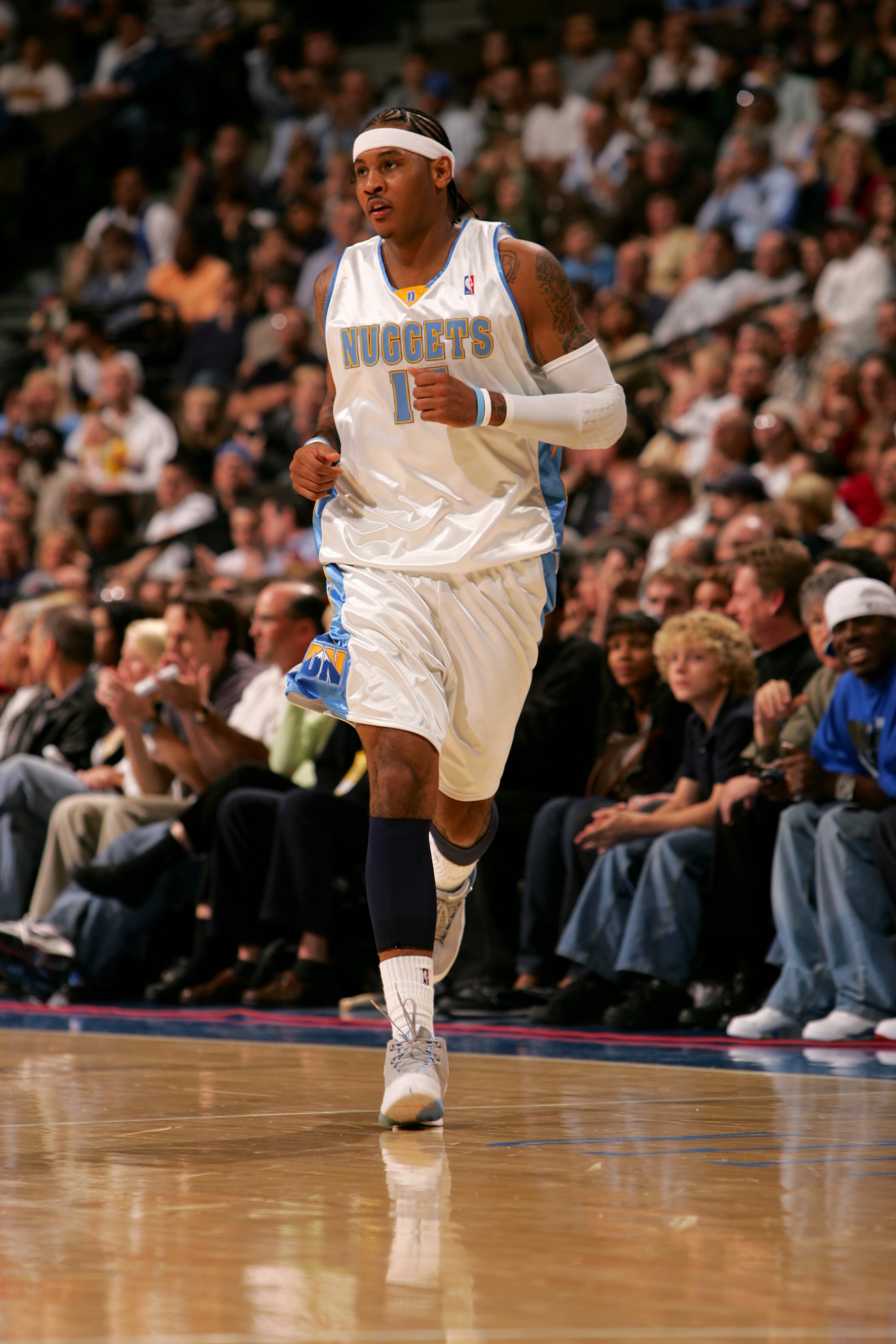 DENVER - NOVEMBER 8:  Carmelo Anthony #15 of the Denver Nuggets jogs on the court during the game against the New York Knicks on November 8, 2006 at the Pepsi Center in Denver, Colorado. The Knicks won 109-107. NOTE TO USER: User expressly acknowledges an