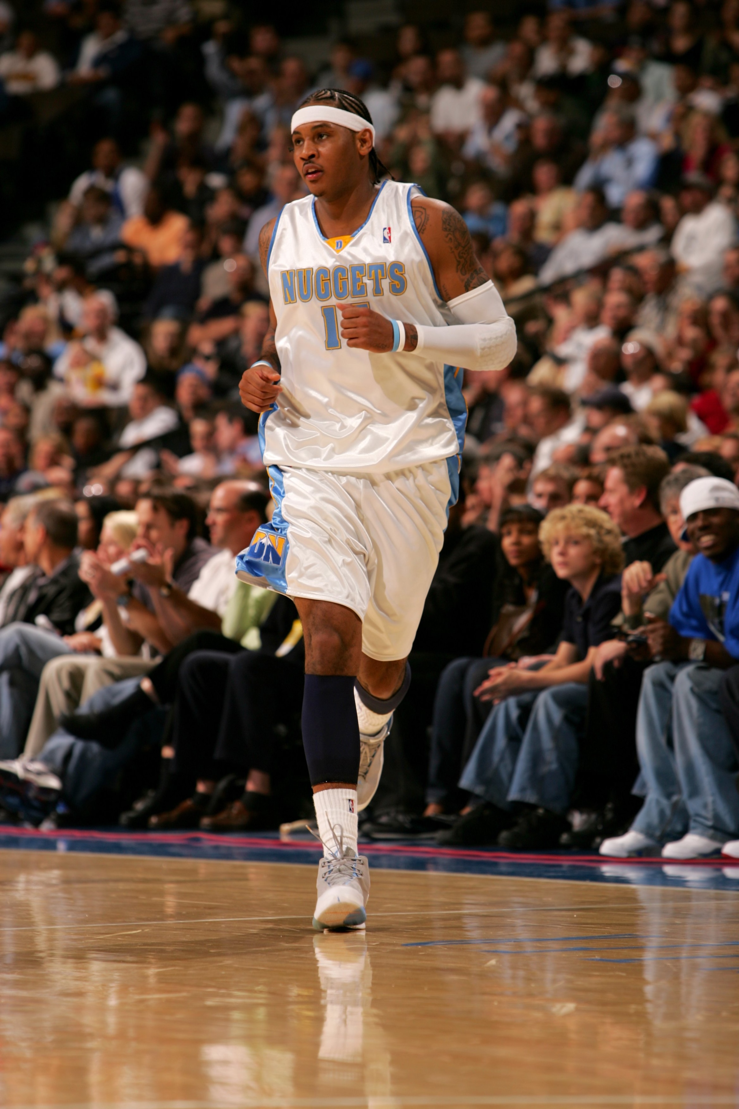 DENVER - NOVEMBER 8:  Carmelo Anthony #15 of the Denver Nuggets jogs on the court during the game against the New York Knicks on November 8, 2006 at the Pepsi Center in Denver, Colorado. The Knicks won 109-107. NOTE TO USER: User expressly acknowledges an