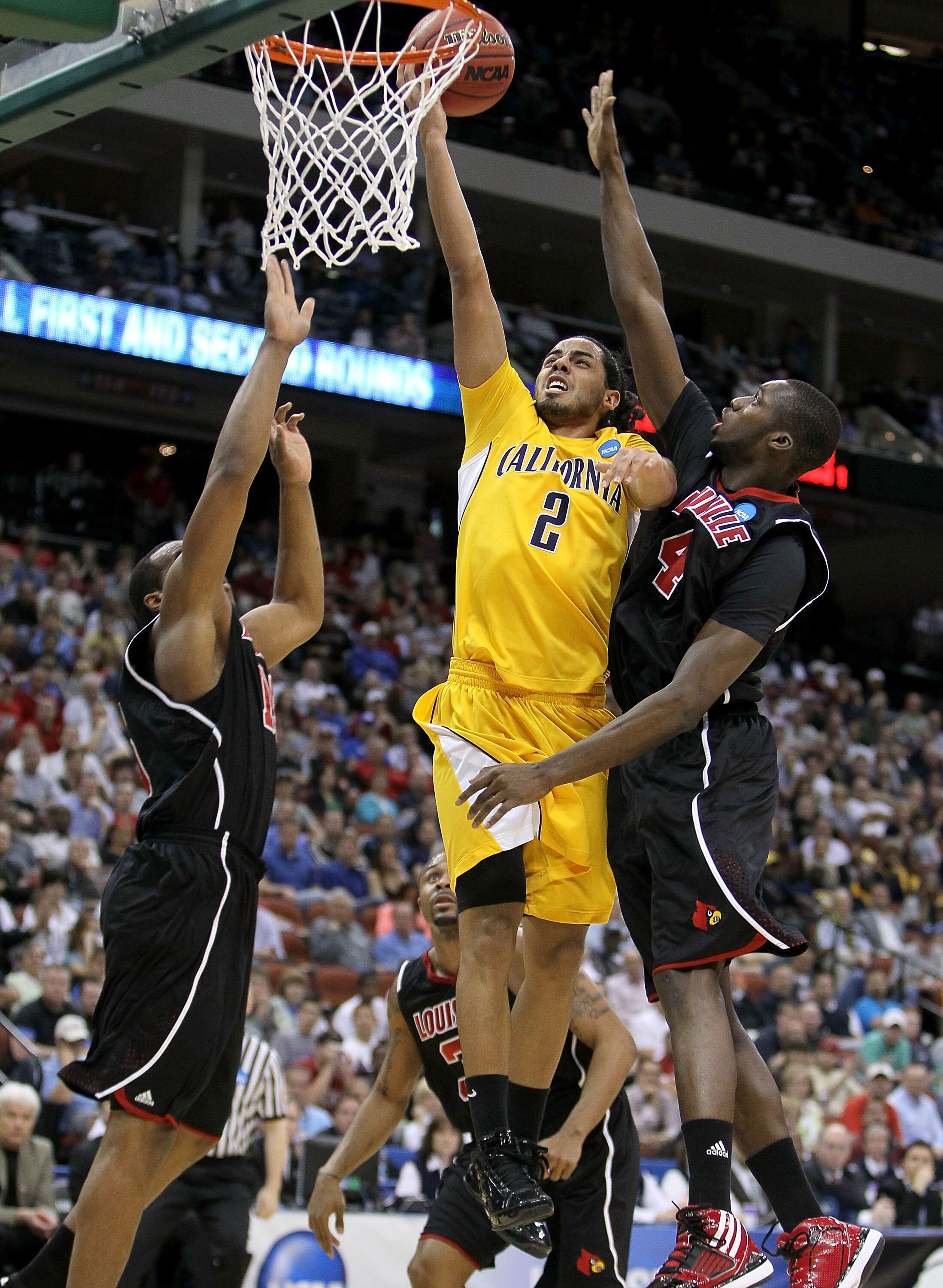 JACKSONVILLE, FL - MARCH 19: Jorge Gutierrez #2 of the California Golden Bears shoots the ball while defended by Rakeem Buckles #4 of the Louisville Cardinals during the first round of the 2010 NCAA men's basketball tournament at Jacksonville Veteran's Me