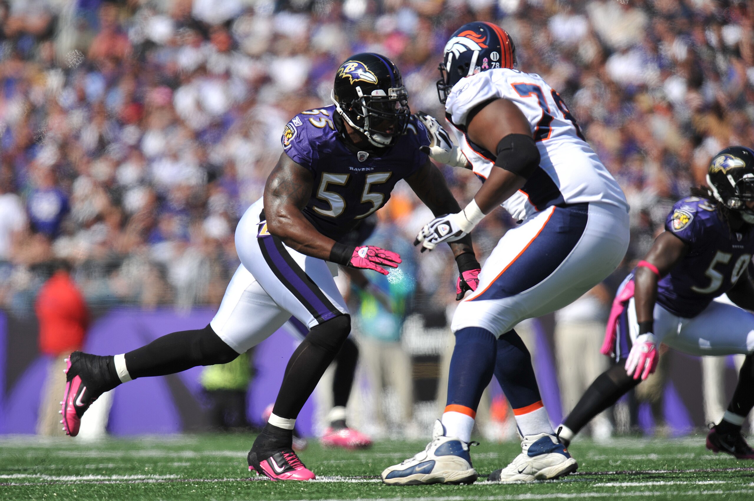 BALTIMORE, MD - OCTOBER 10: Terrell Suggs #55 of the Baltimore Ravens defends against the Denver Broncos at M&T Bank Stadium on October 10, 2010 in Baltimore, Maryland. Players wore pink in recognition of Breast Cancer Awareness Month. The Ravens defeated BALTIMORE, MD - OCTOBER 10: Terrell Suggs #55 of the Baltimore Ravens defends against the Denver Broncos at M&T Bank Stadium on October 10, 2010 in Baltimore, Maryland. Players wore pink in recognition of Breast Cancer Awareness Month. The Ravens defeated