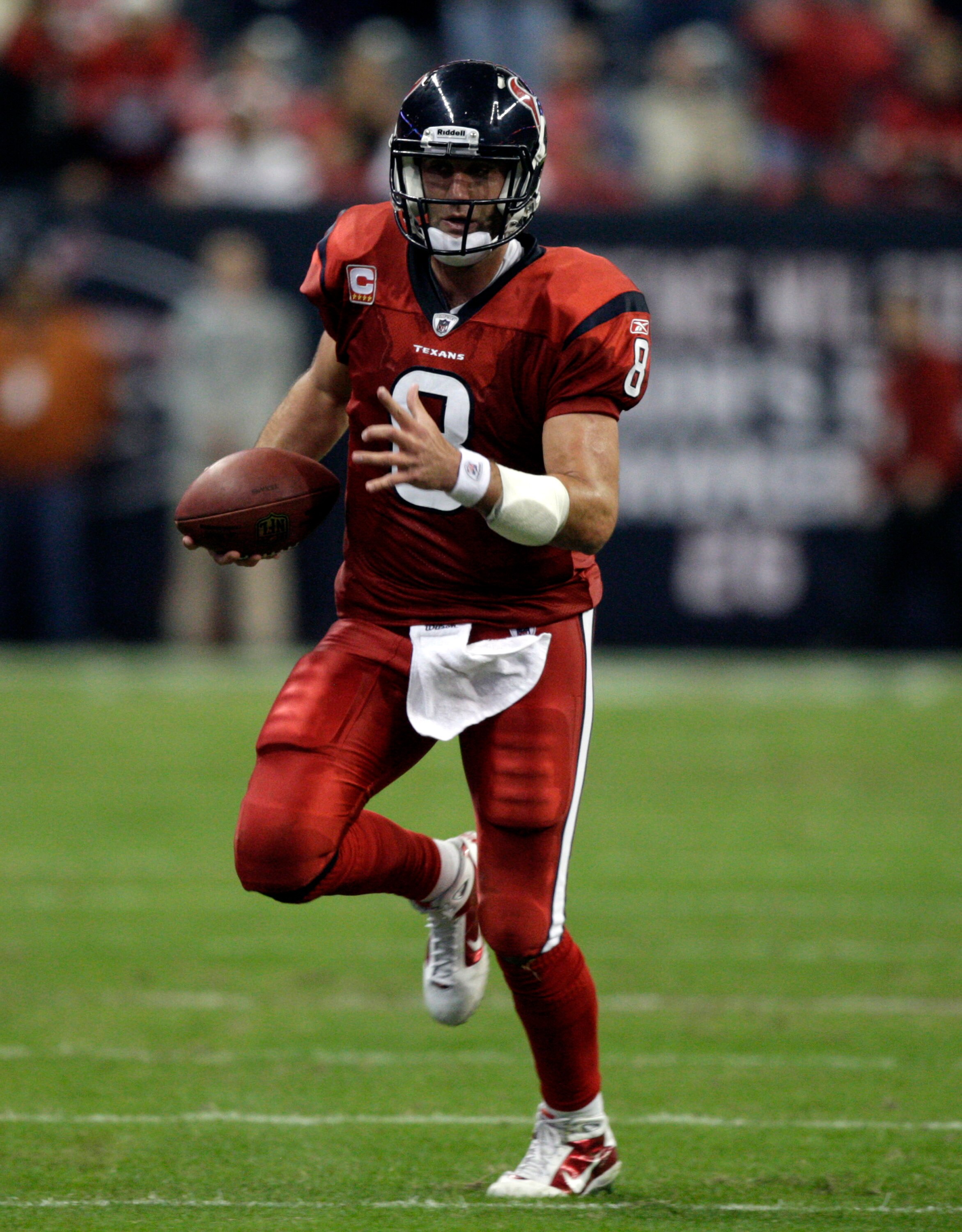 HOUSTON, TX - DECEMBER 13:  Quarterback Matt Schaub #8 of the Houston Texans runs out of the pocket as he looks for a receiver against the Baltimore Ravens at Reliant Stadium on December 13, 2010 in Houston, Texas.  (Photo by Bob Levey/Getty Images)