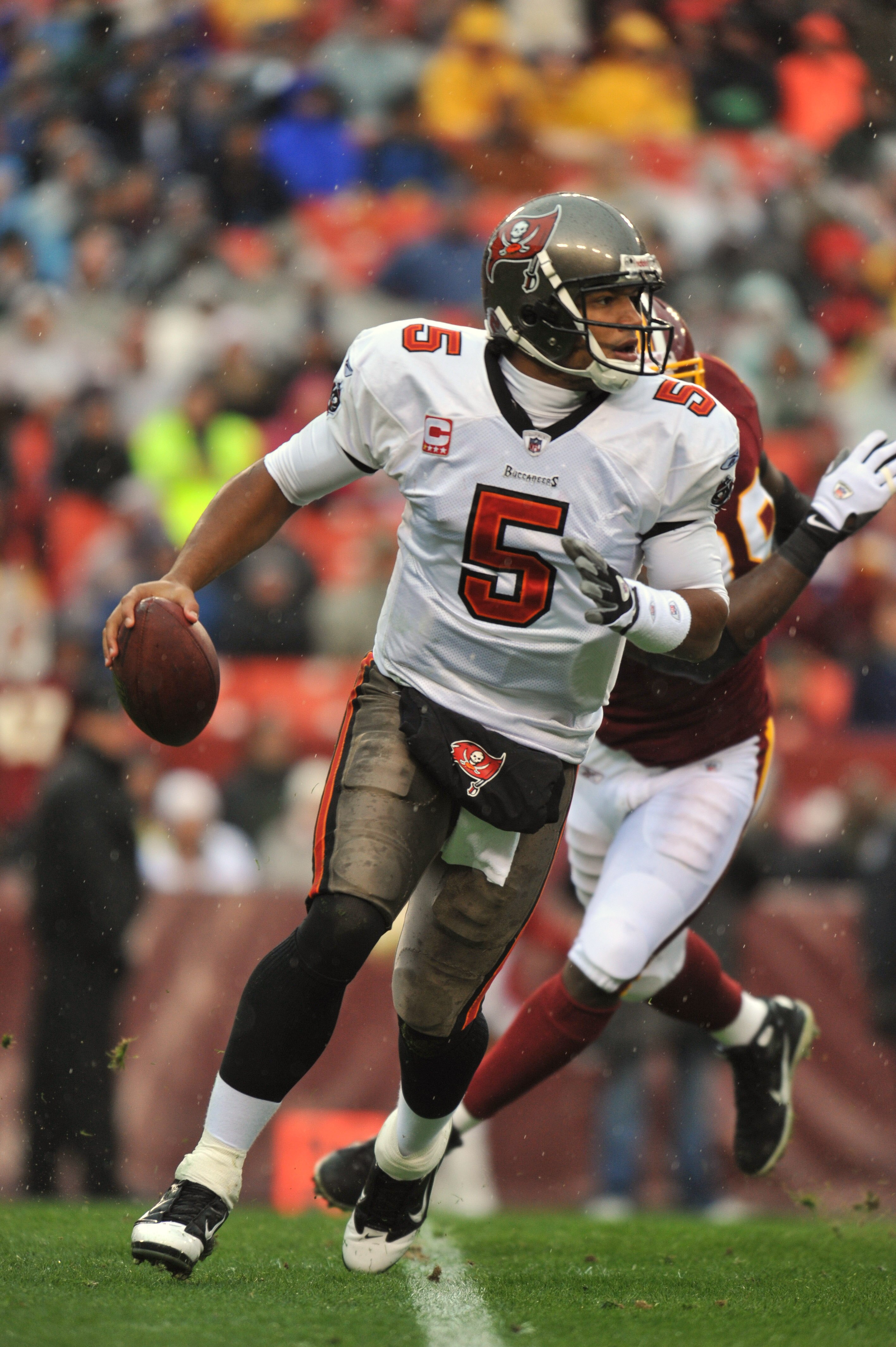 LANDOVER, MD - DECEMBER 12:  Josh Freeman #5 of the Tampa Bay Buccaneers looks for a receiver during the game against the Washington Redskins  at FedExField on December 12, 2010 in Landover, Maryland. The Buccaneers defeated the Redskins 17-16. (Photo by