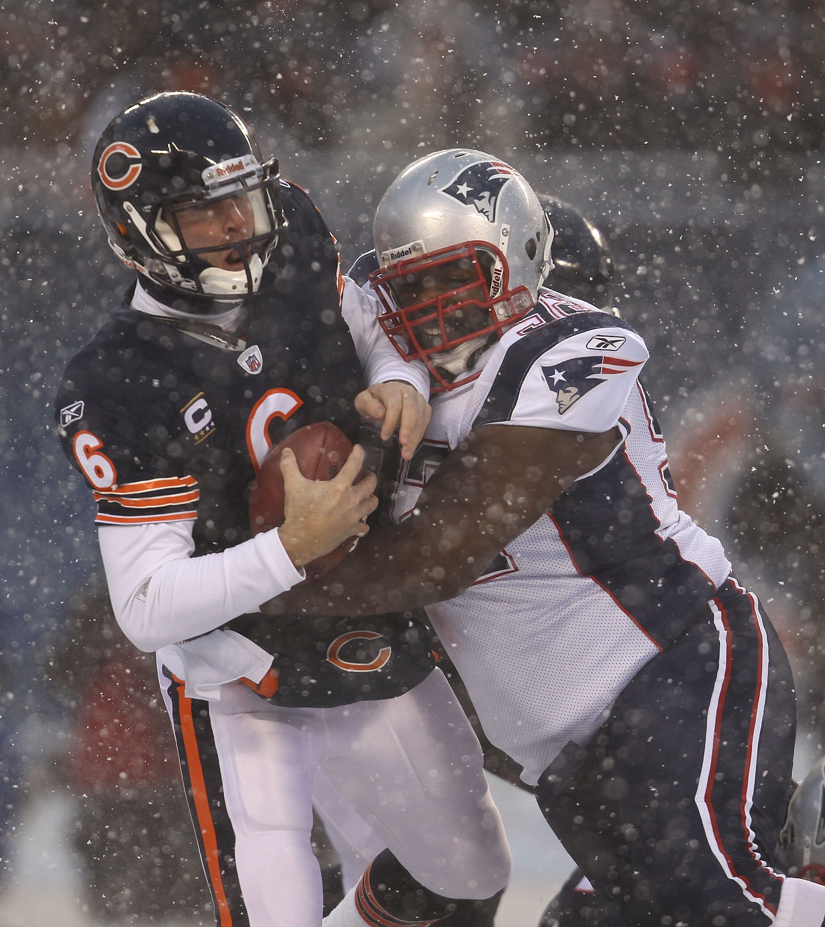 CHICAGO, IL - DECEMBER 12: Jay Cutler #6 of the Chicago Bears is sacked by Gerard Warren #92 of the New England Patriots at Soldier Field on December 12, 2010 in Chicago, Illinois.  The Patriots defeated the Bears 36-7. (Photo by Jonathan Daniel/Getty Ima