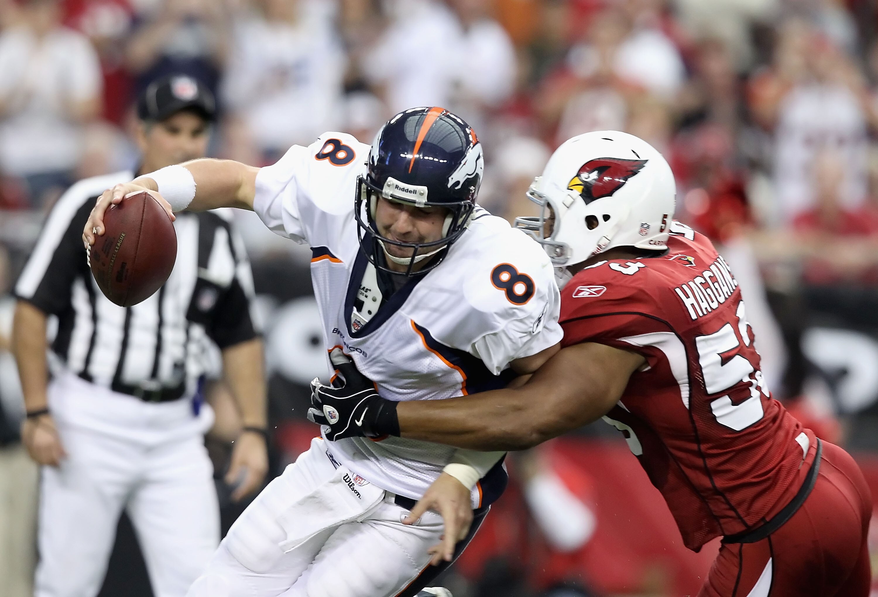 GLENDALE, AZ - DECEMBER 12:  Quarterback Kyle Orton #8 of the Denver Broncos is sacked by Clark Haggans #53 of the Arizona Cardinals during the NFL game at the University of Phoenix Stadium on December 12, 2010 in Glendale, Arizona.  The Cardinals defeate