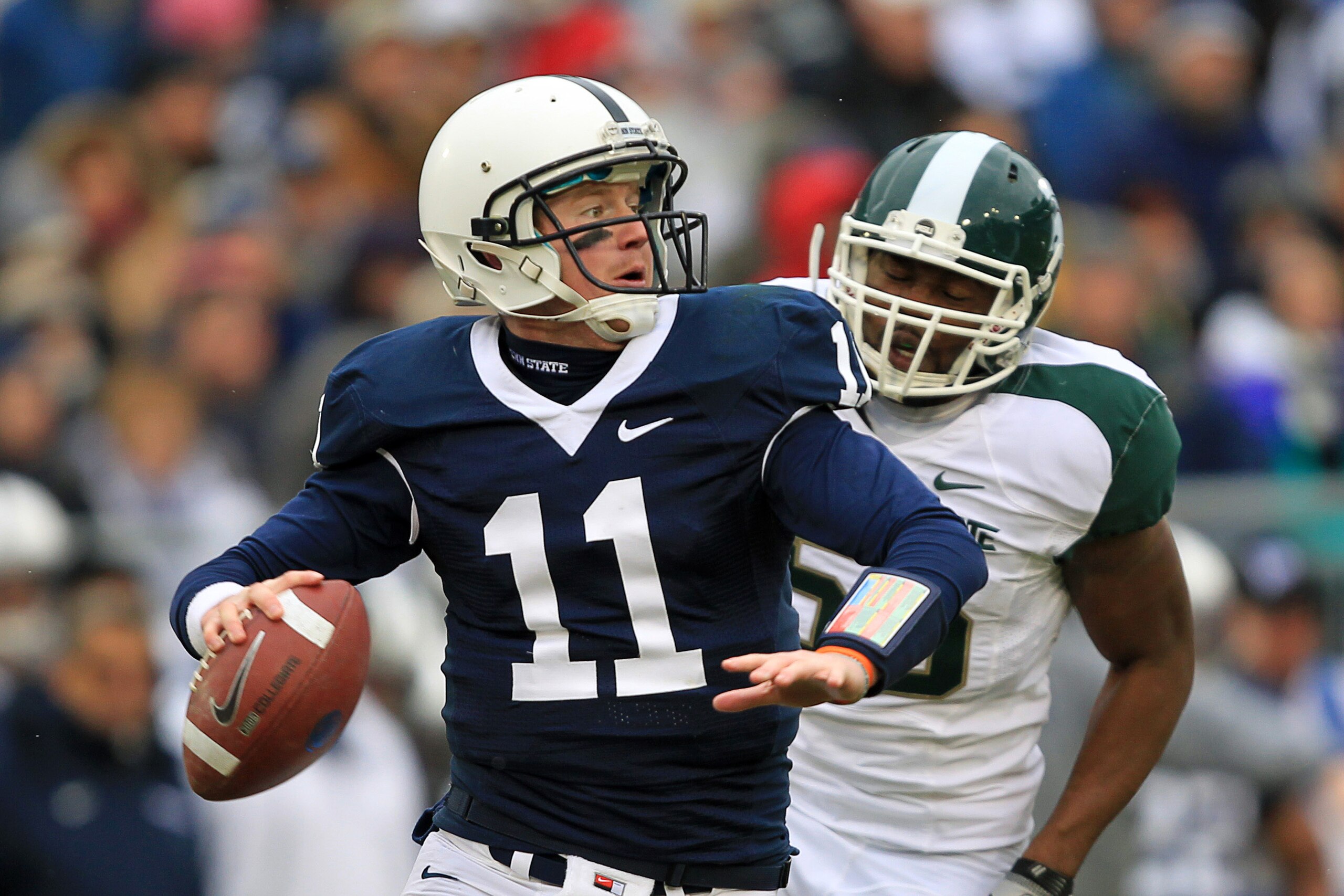 STATE COLLEGE, PA - NOVEMBER 27: Quarterback Matt McGloin #11 of the Penn State Nittany Lions throws a pass during a game against the Michigan State Spartans on November 27, 2010 at Beaver Stadium in State College, Pennsylvania. The Spartans won 28-22. (P