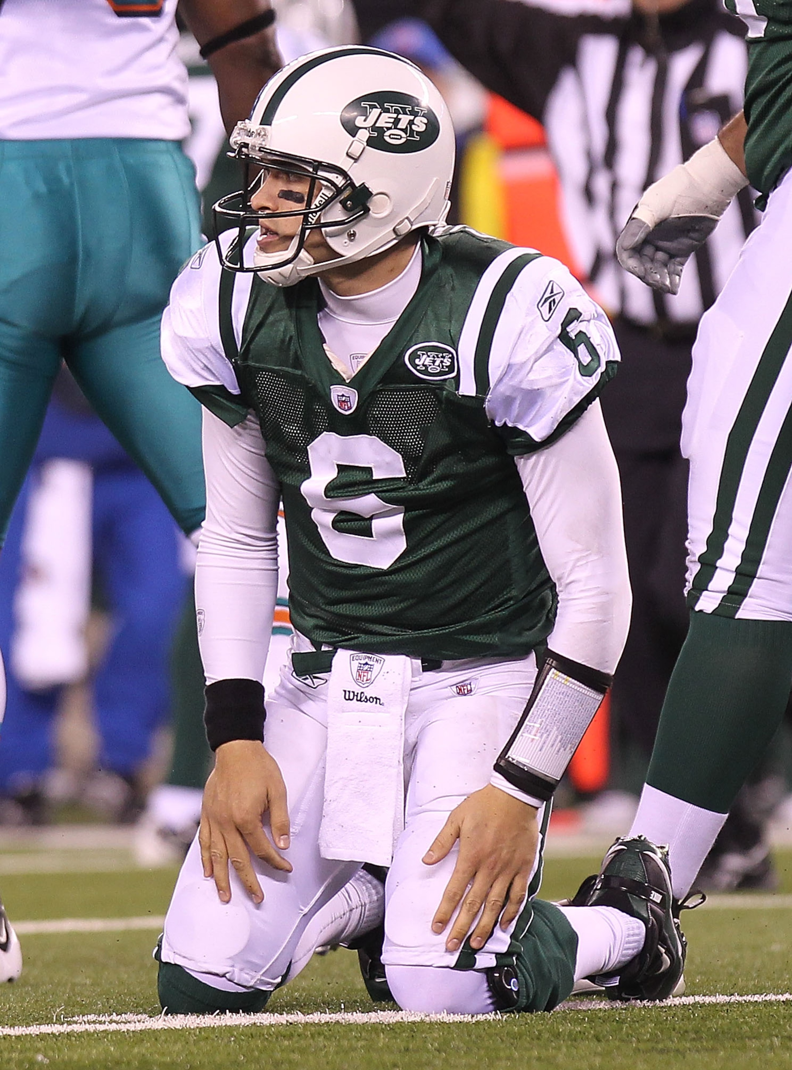 EAST RUTHERFORD, NJ - DECEMBER 12:  Mark Sanchez #6 of the New York Jets picks himself up after an incomplete pass against the Miami Dolphins at New Meadowlands Stadium on December 12, 2010 in East Rutherford, New Jersey.  (Photo by Nick Laham/Getty Image
