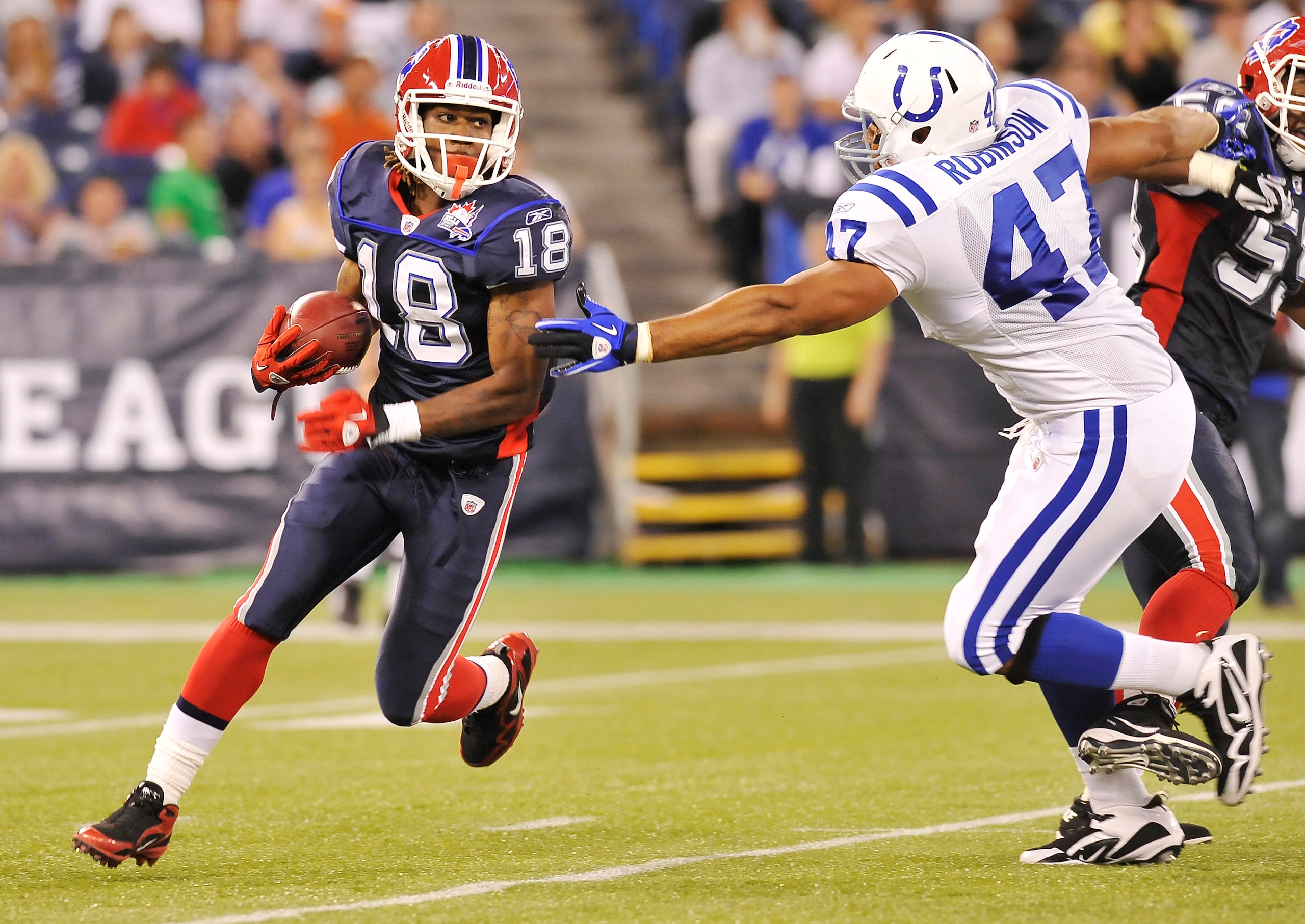 TORONTO - AUGUST 19:  Naaman Roosevelt #18 of the Buffalo Bills avoids the takle of Gijon Robinson #47 of the Indianapolis Colts during game action August 19, 2010 at the Rogers Centre in Toronto, Ontario, Canada. (Photo by Brad White/Getty Images)