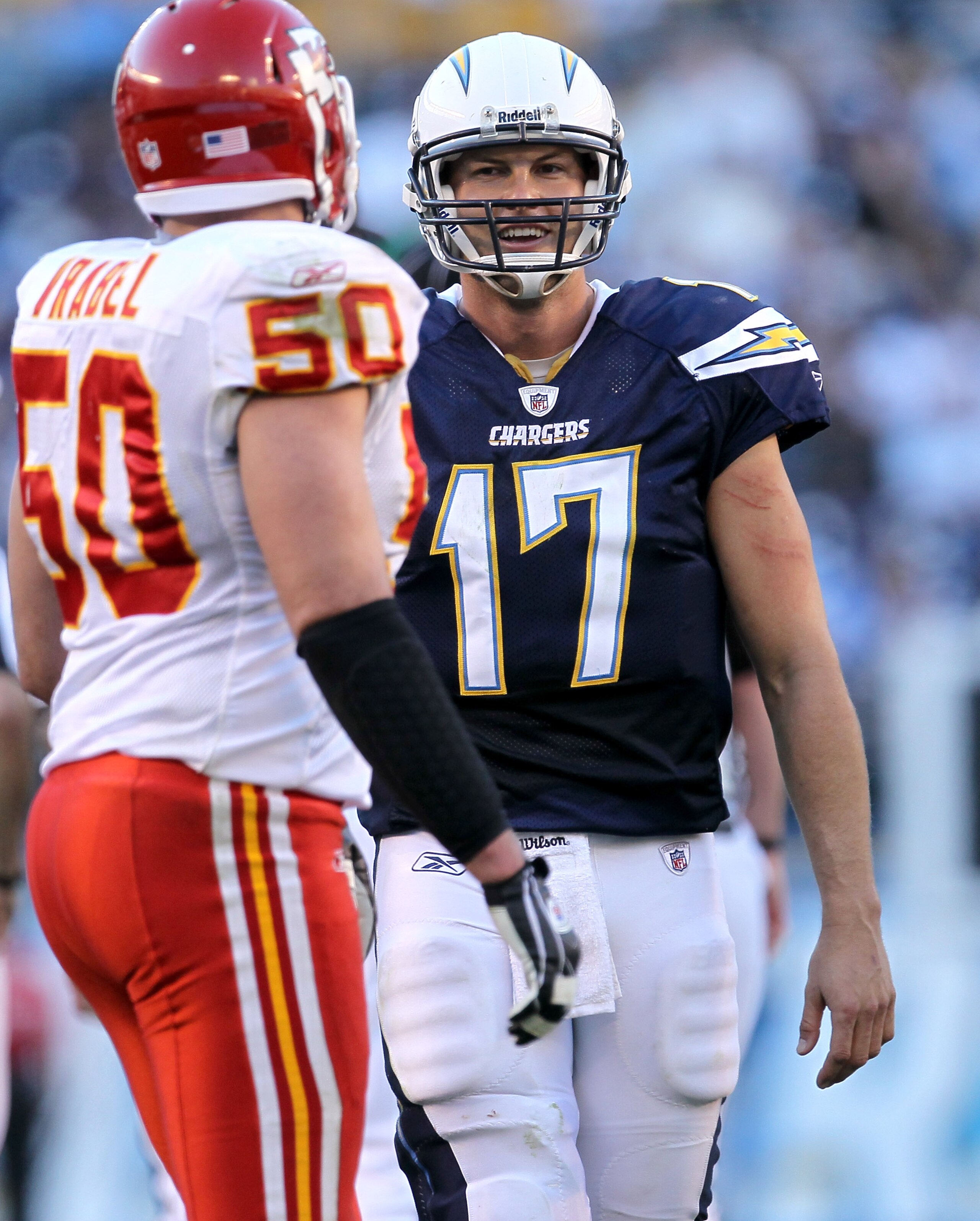 SAN DIEGO - DECEMBER 12:  Quarterback Philip Rivers #17 of the San Diego Chargers laughs as he talks to linebacker Mike Vrabel #50 of the Kansas City Chiefs at Qualcomm Stadium on December 12, 2010 in San Diego, California.  the Chargers won 31-0.  (Photo
