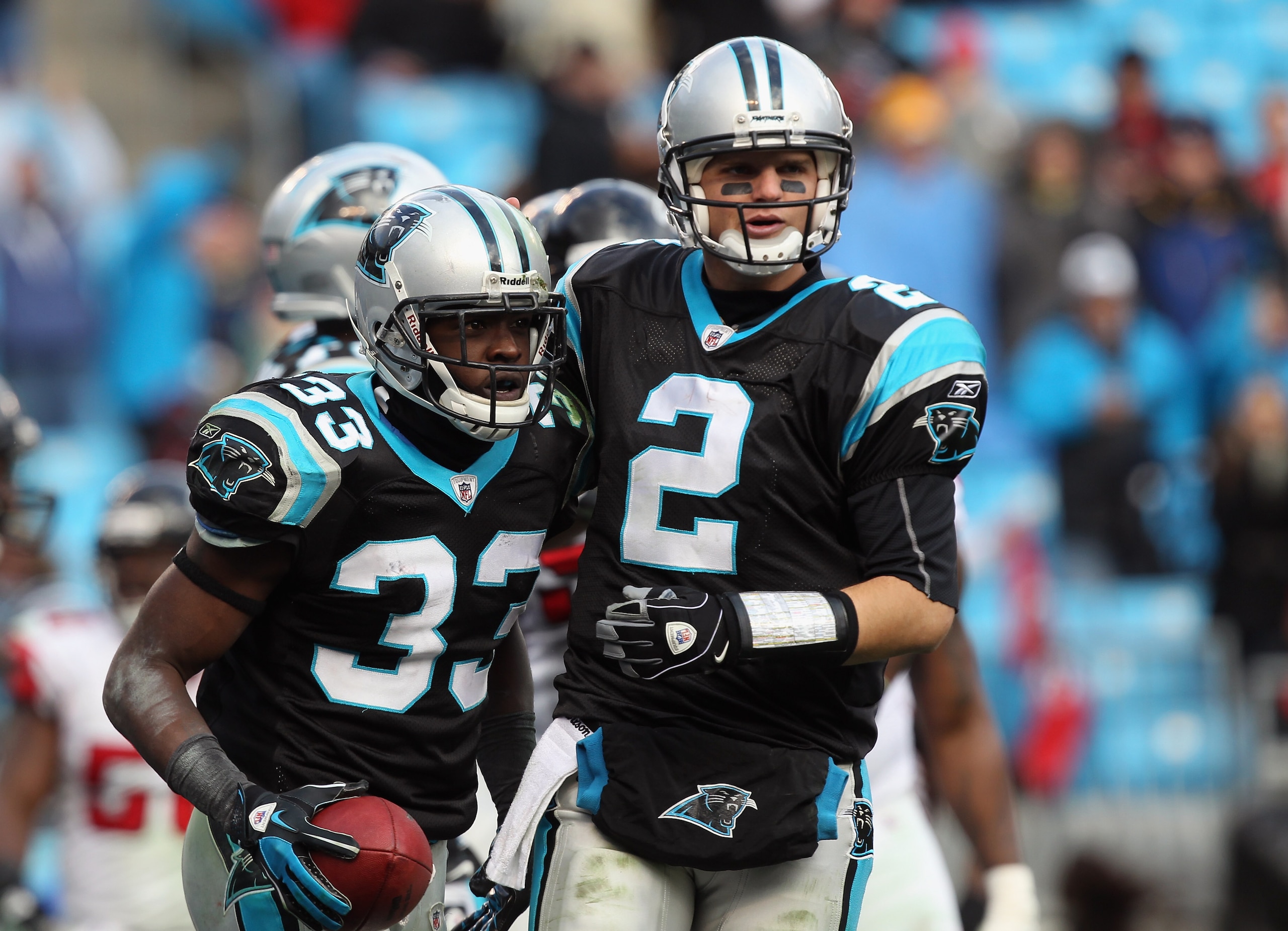 CHARLOTTE, NC - DECEMBER 12:  Teammates Casey Clausen #2 and Mike Goodson #33 of the Carolina Panthers during their game against the Atlanta Falcons at Bank of America Stadium on December 12, 2010 in Charlotte, North Carolina.  (Photo by Streeter Lecka/Ge