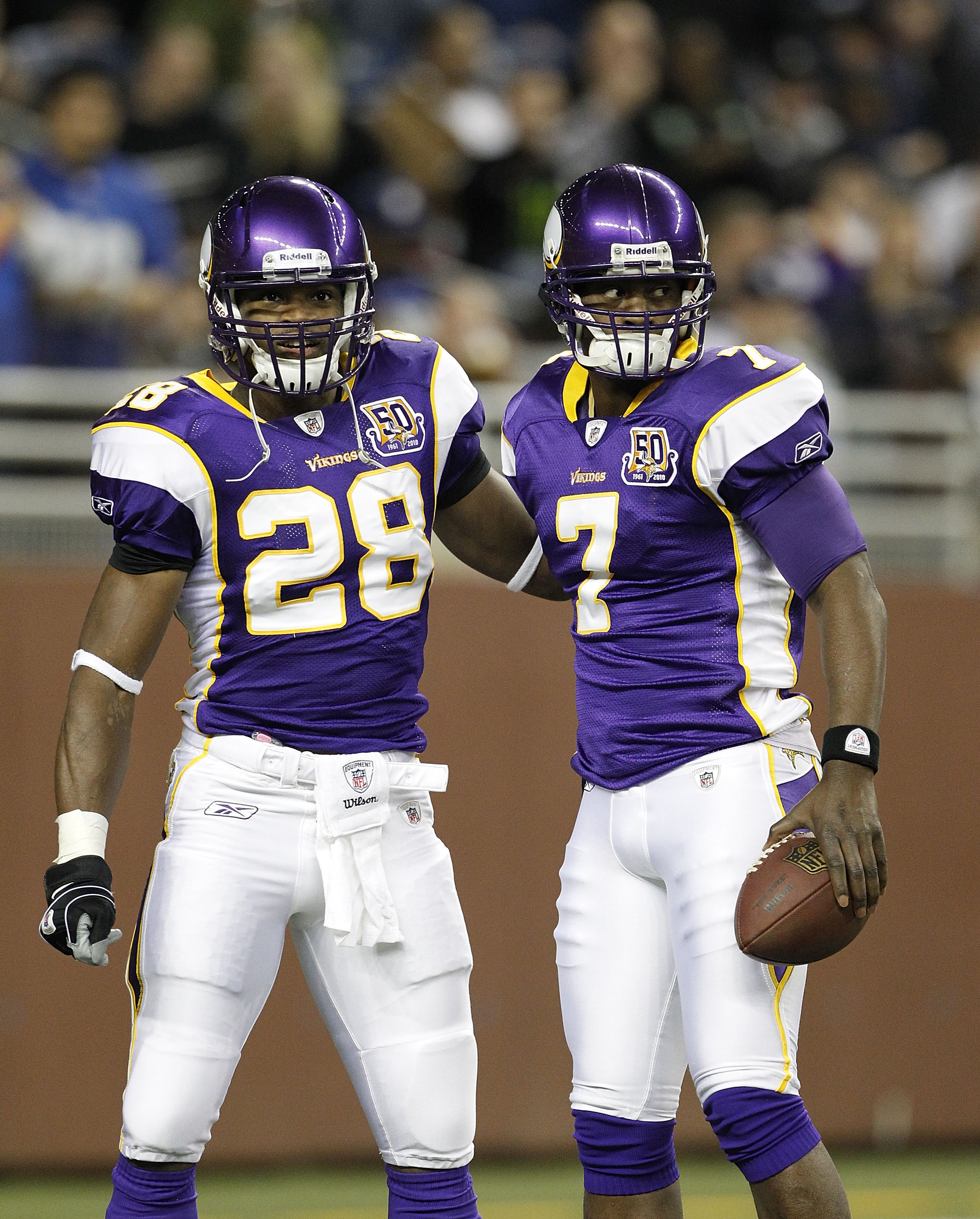 DETROIT, MI - DECEMBER 13: Adrian Peterson #28 and Tavaris Jackson #7 of the Minnesota Vikings prior to the start of the game against the New York Giants on December 13, 2010 in Detroit, Michigan.  (Photo by Leon Halip/Getty Images)