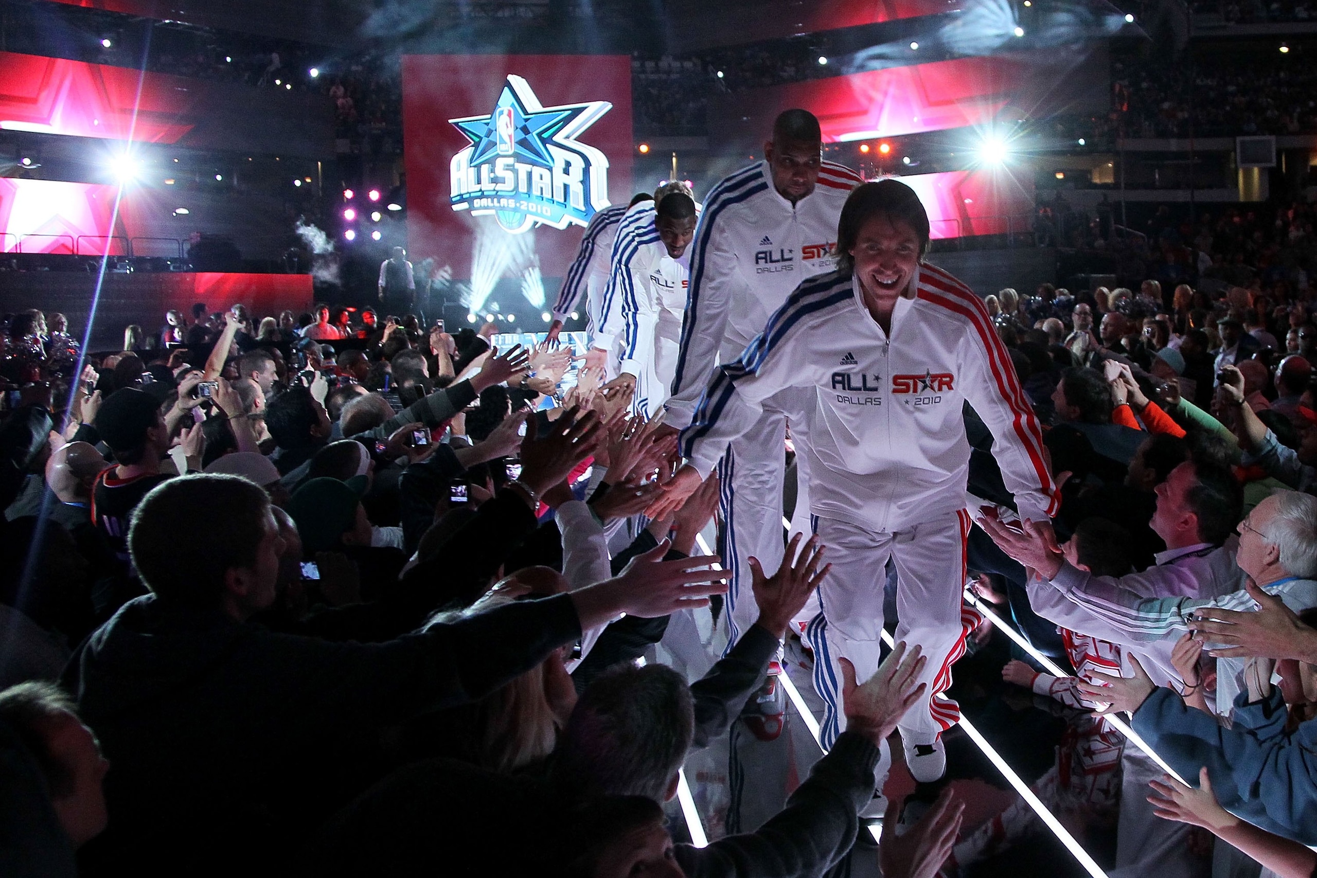 ARLINGTON, TX - FEBRUARY 14:  Steve Nash #13, Tim Duncan #21 and other members of the Western Conference shake hands with fans during introductions before the NBA All-Star Game, part of 2010 NBA All-Star Weekend at Cowboys Stadium on February 14, 2010 in 