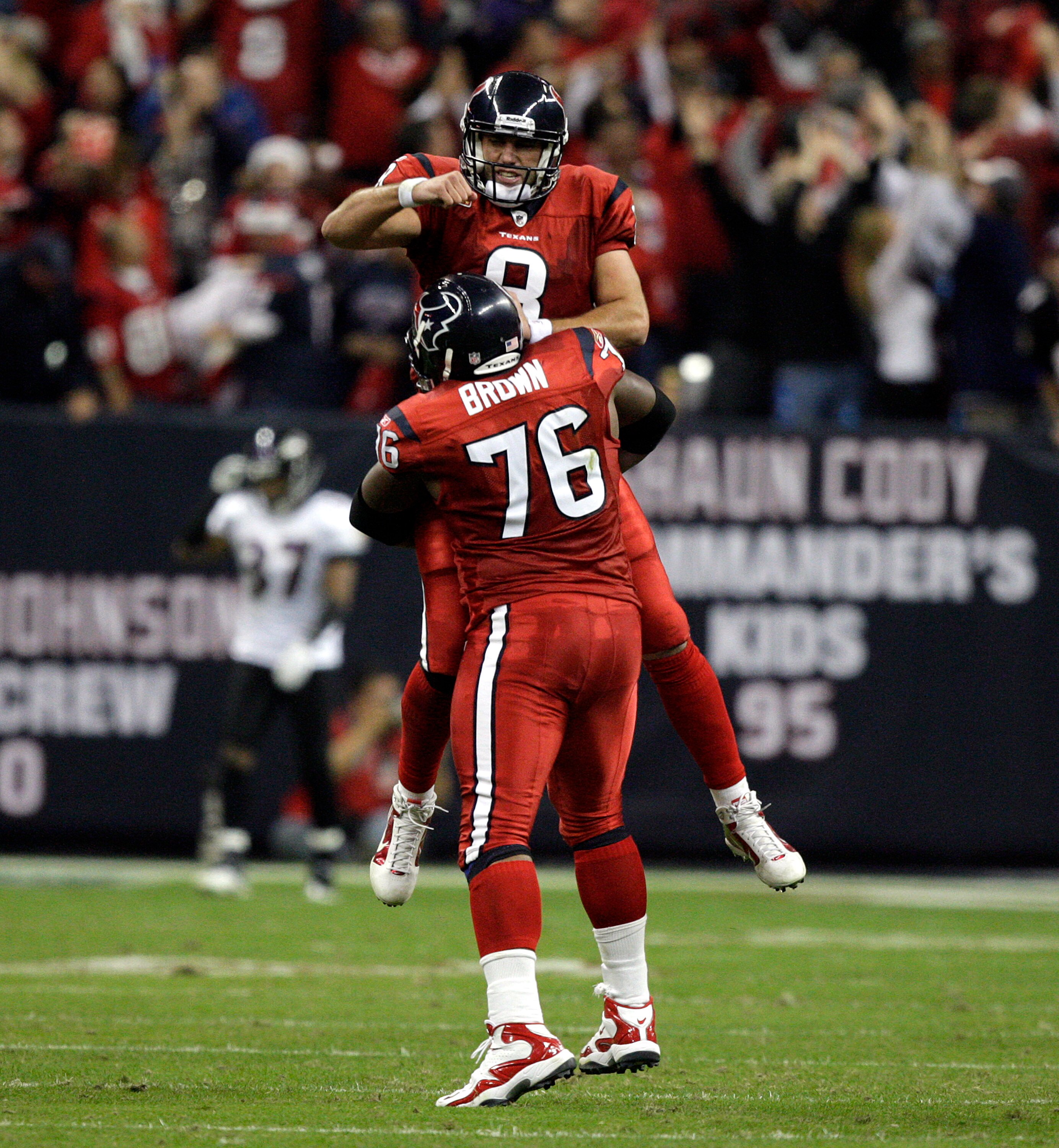 HOUSTON, TX - DECEMBER 13:  Quarterback Matt Schaub #8 of the Houston Texans celebratres with tackle Duane Brown #76 after throwing a 46 yard touchdown pass to Andre Johnson late in the second quarter against the Baltimore Ravens at Reliant Stadium on Dec