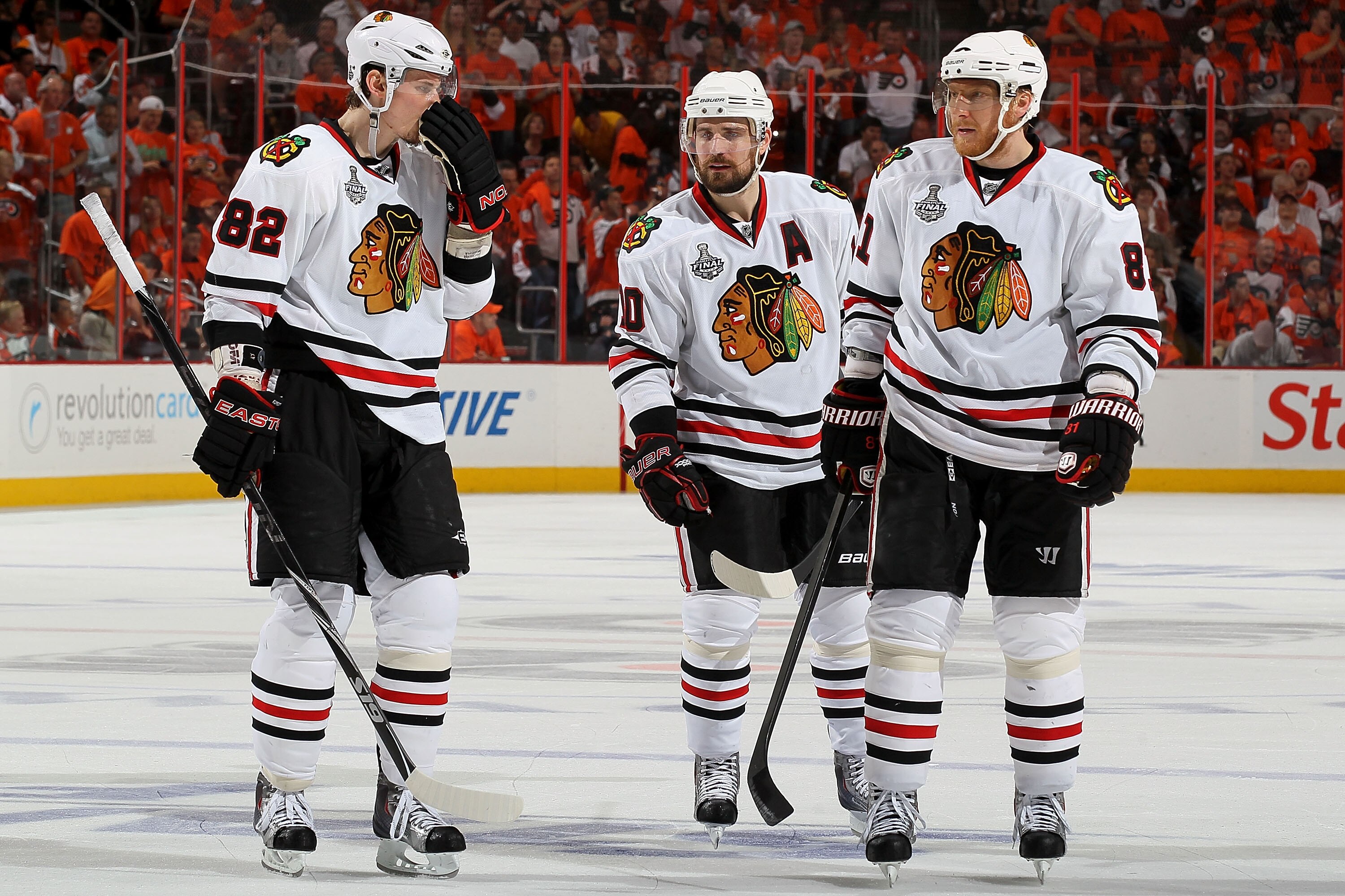PHILADELPHIA - JUNE 04:  Tomas Kopecky #82, Patrick Sharp #10, and Marian Hossa #81 of the Chicago Blackhawks react after Ville Leino #22 of the Philadelphia Flyers scoreda goal in the third period in Game Four of the 2010 NHL Stanley Cup Final at Wachovi